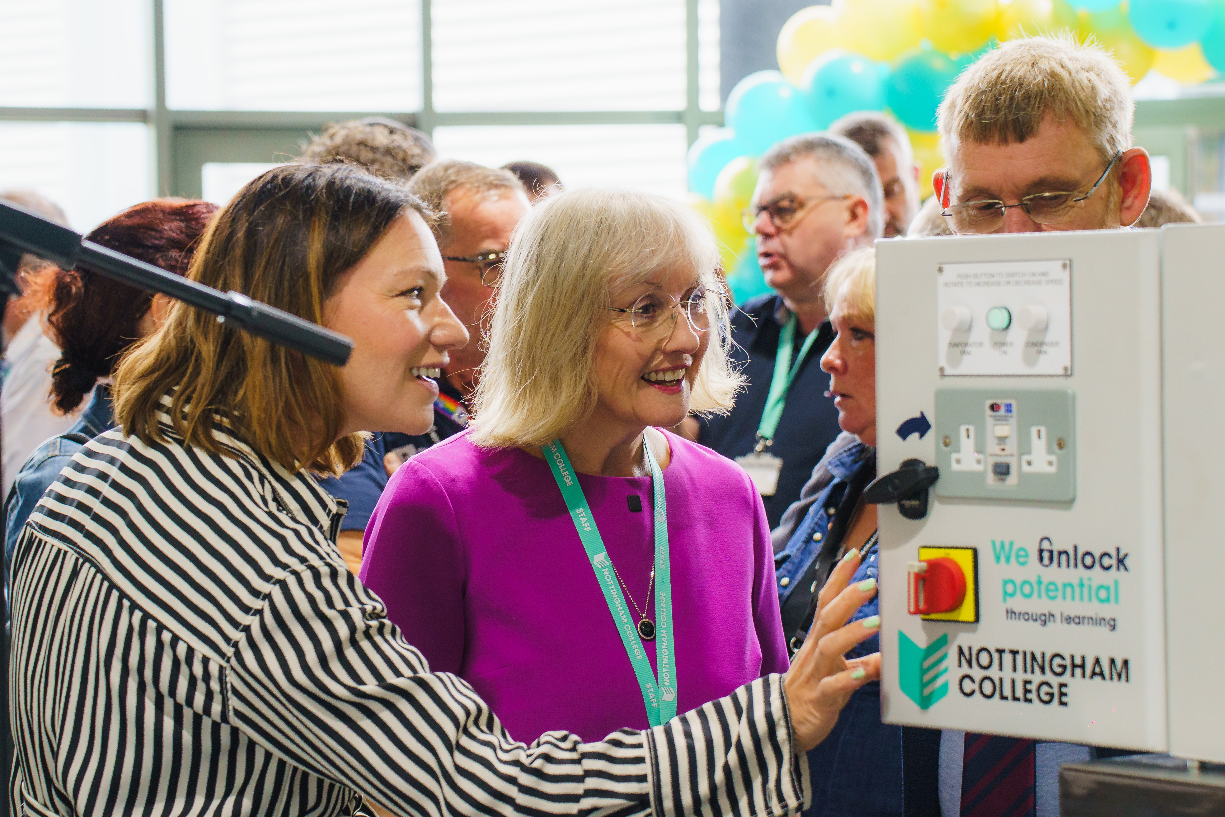 College representatives opening the electrical box