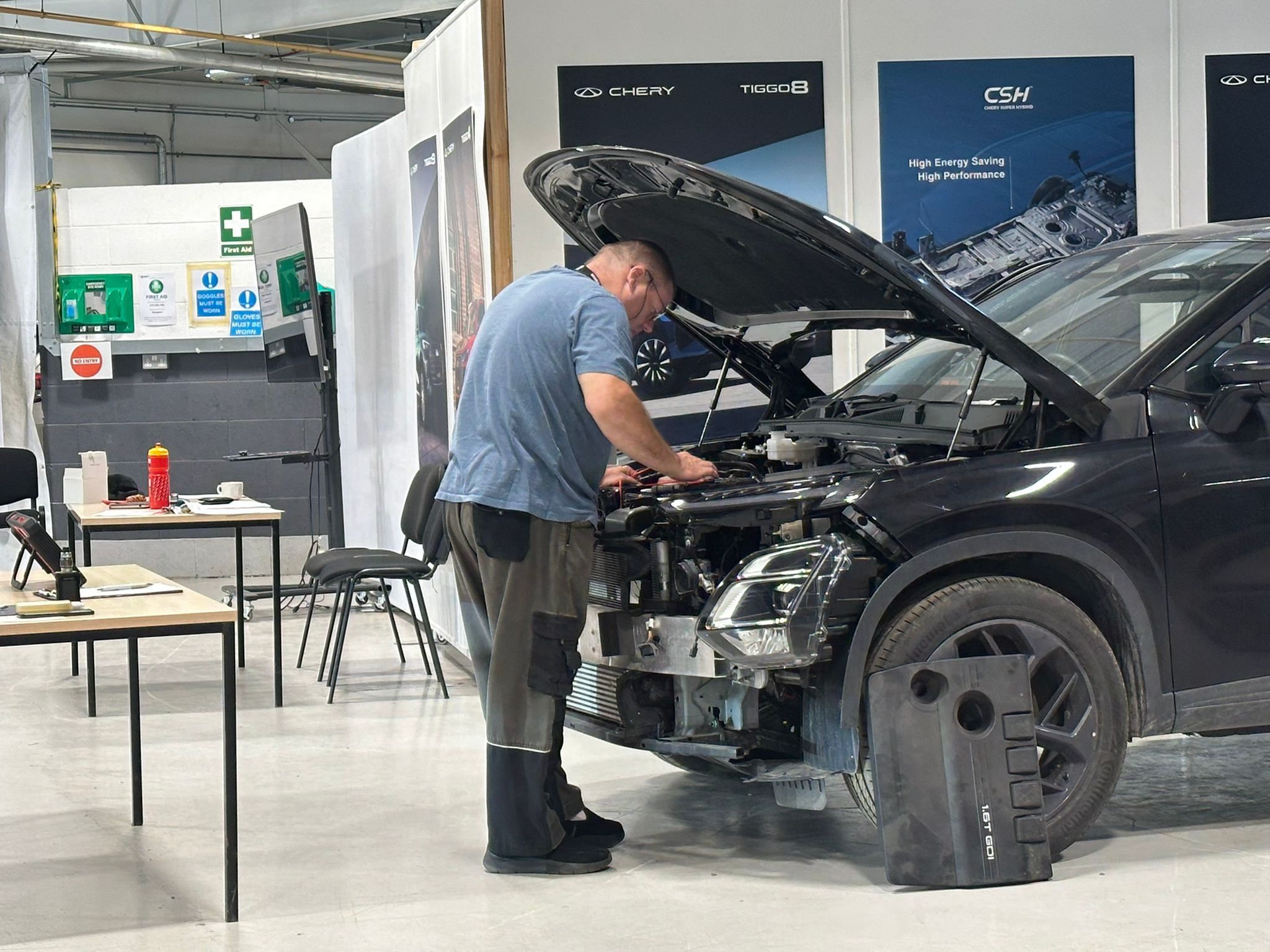 Car Tech assessing a vehicle