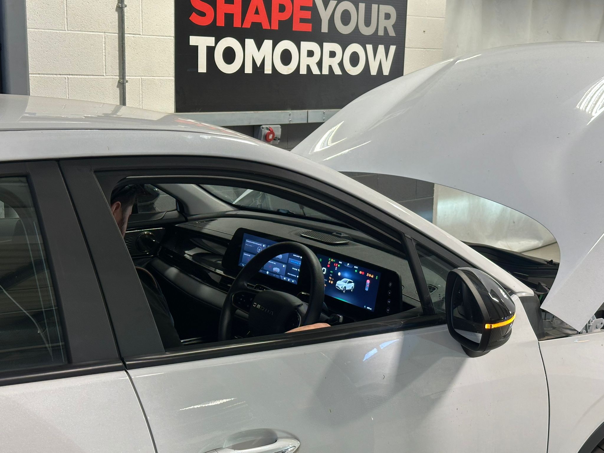 Car Tech assessing a vehicle