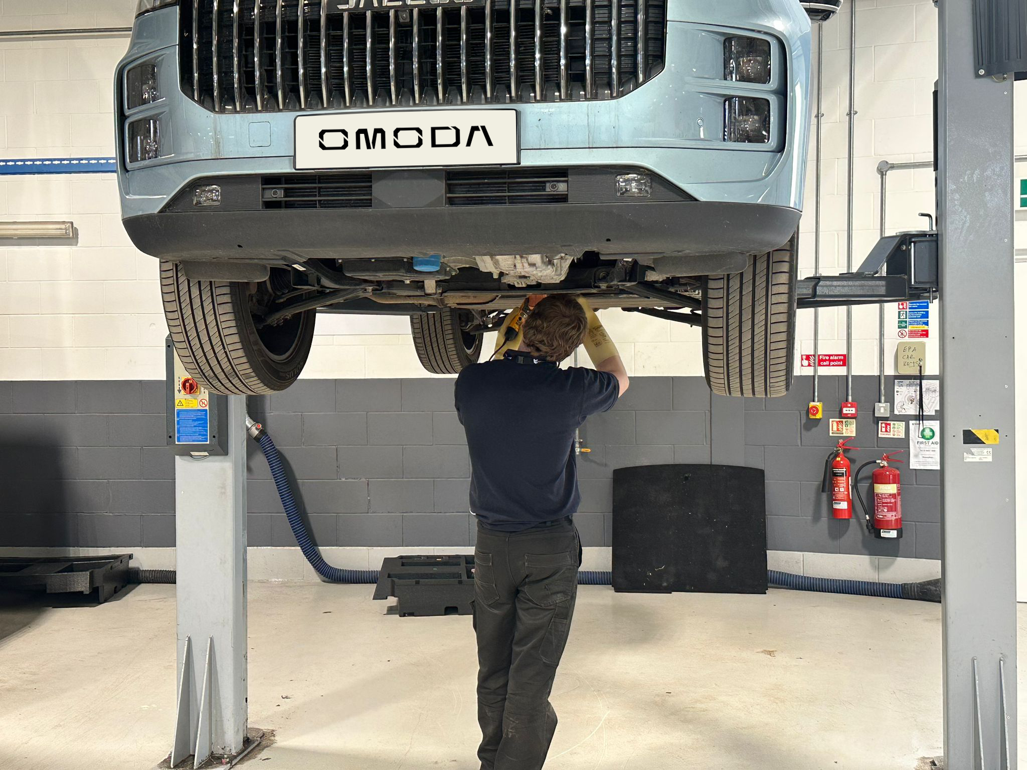 Car Tech assessing a vehicle