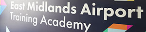 A photograph of a sign saying East Midlands Airport Training Academy