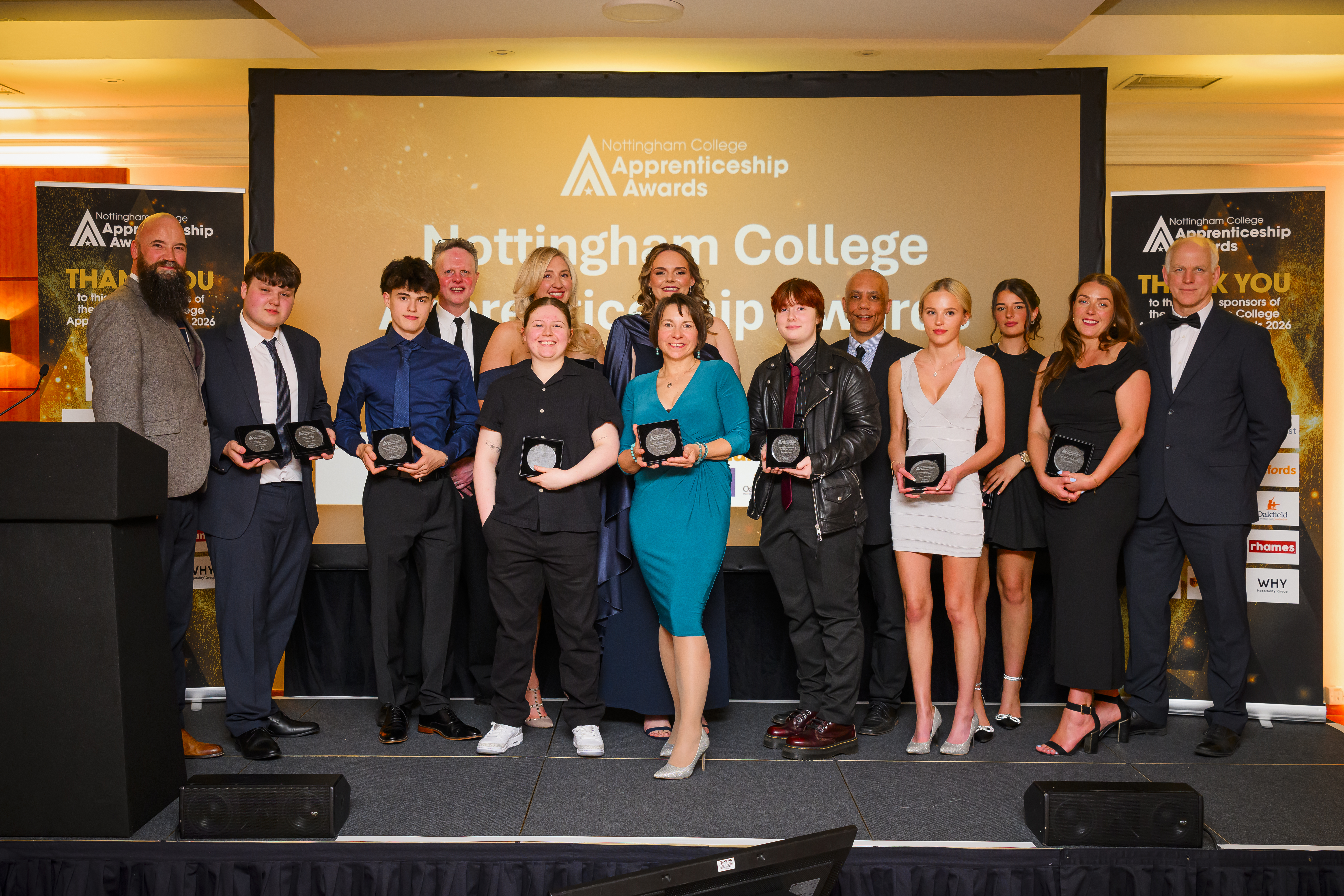 All winners on stage with their trophies