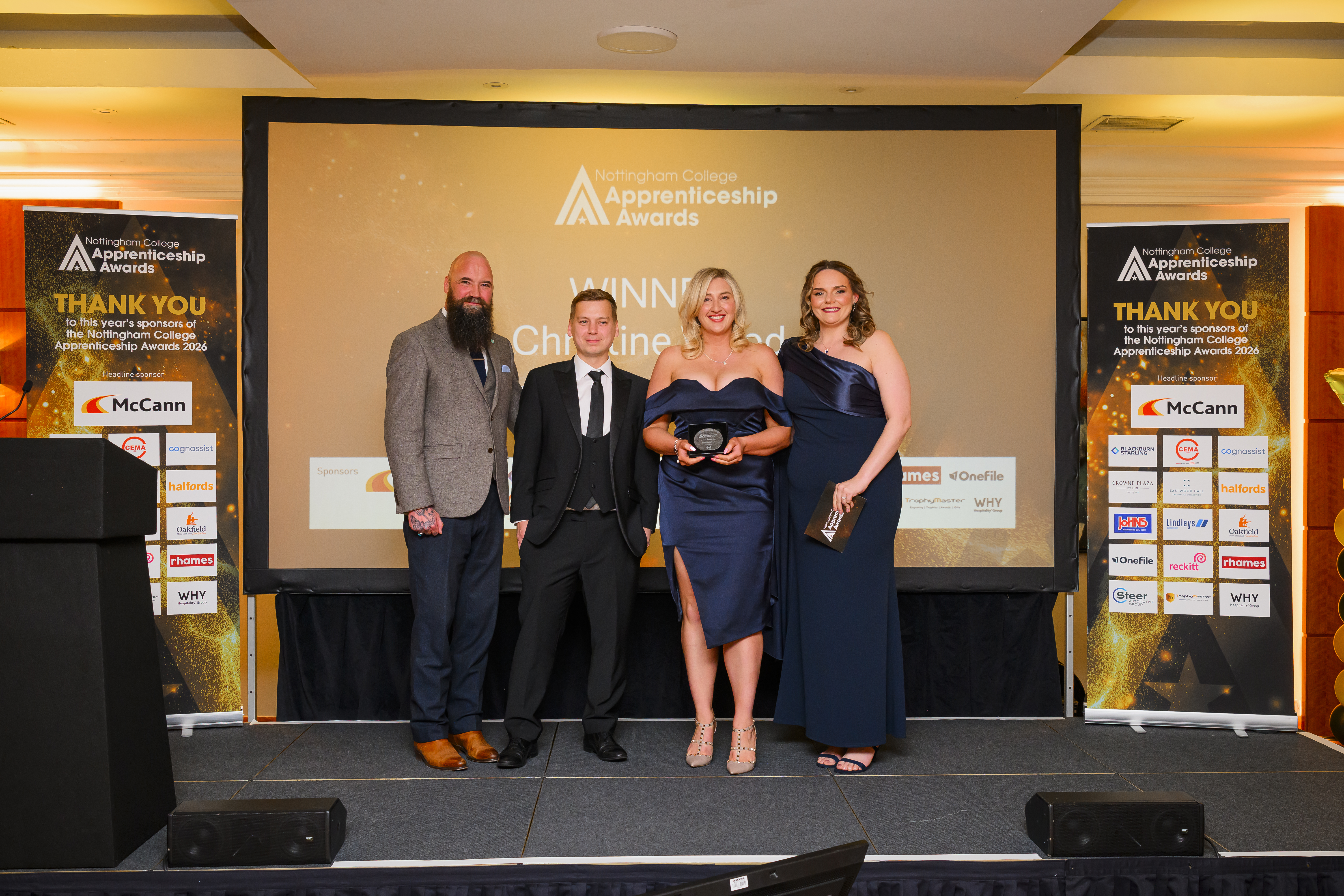 Christine Wood on stage with sponsor and Nottingham College staff