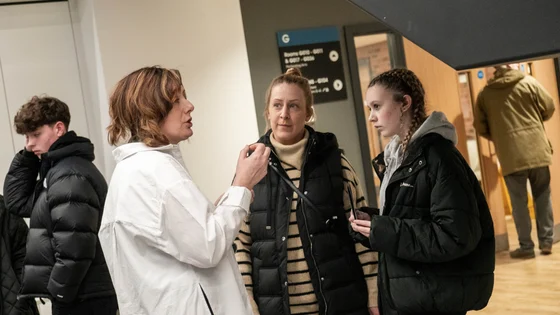 Visitors talking inside the City Hub campus.