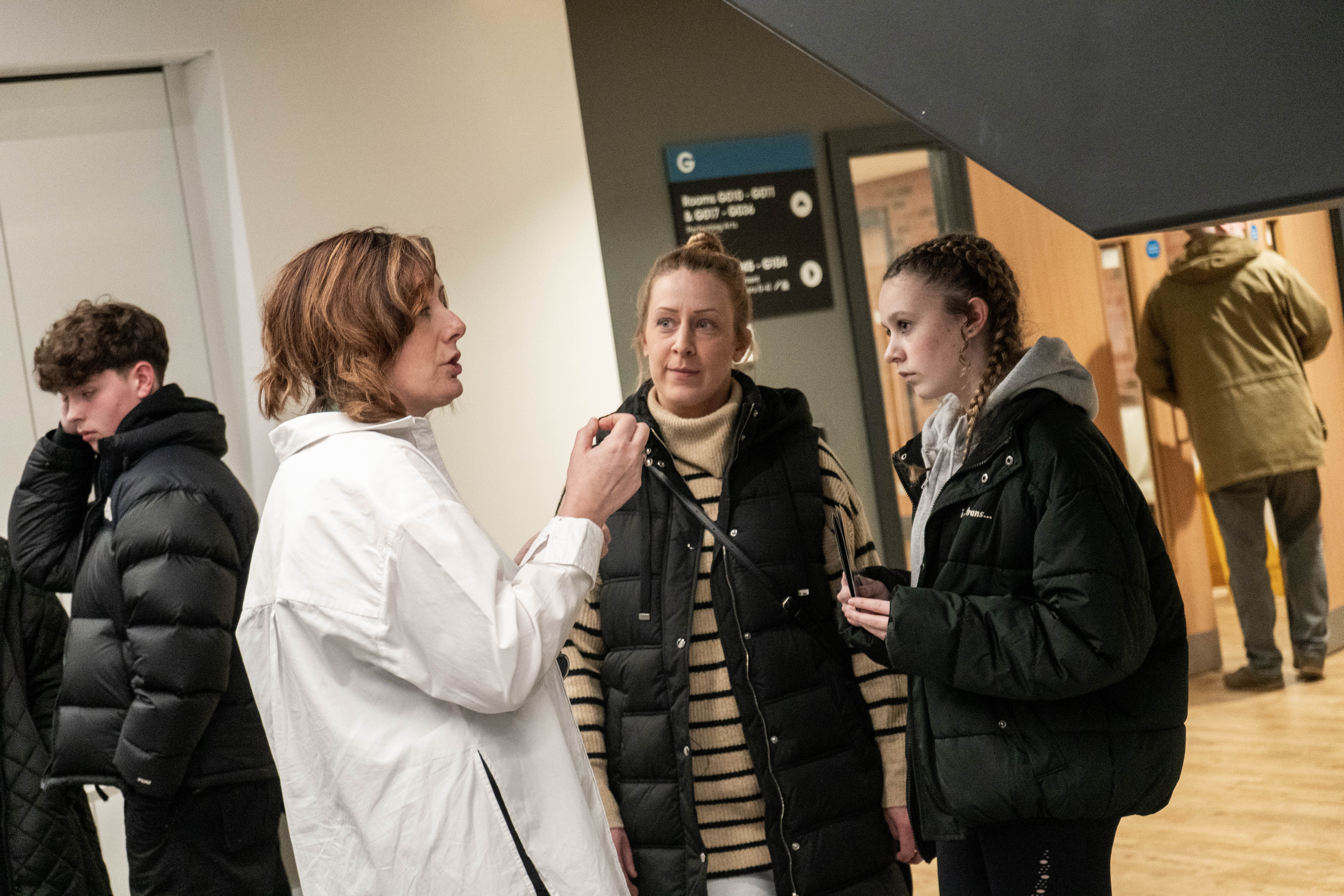 Visitors talking inside the City Hub campus.