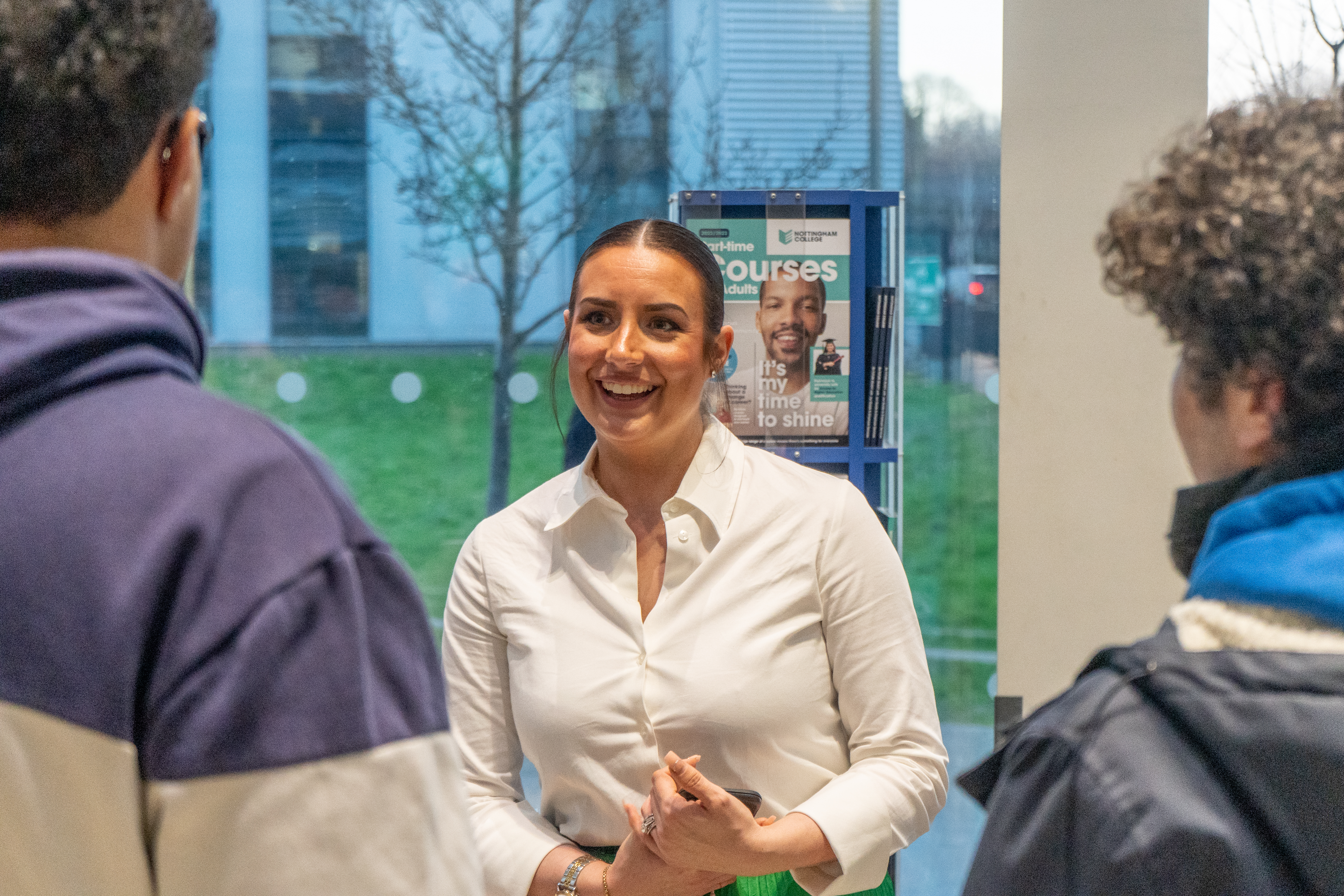 Visitors speaking to students