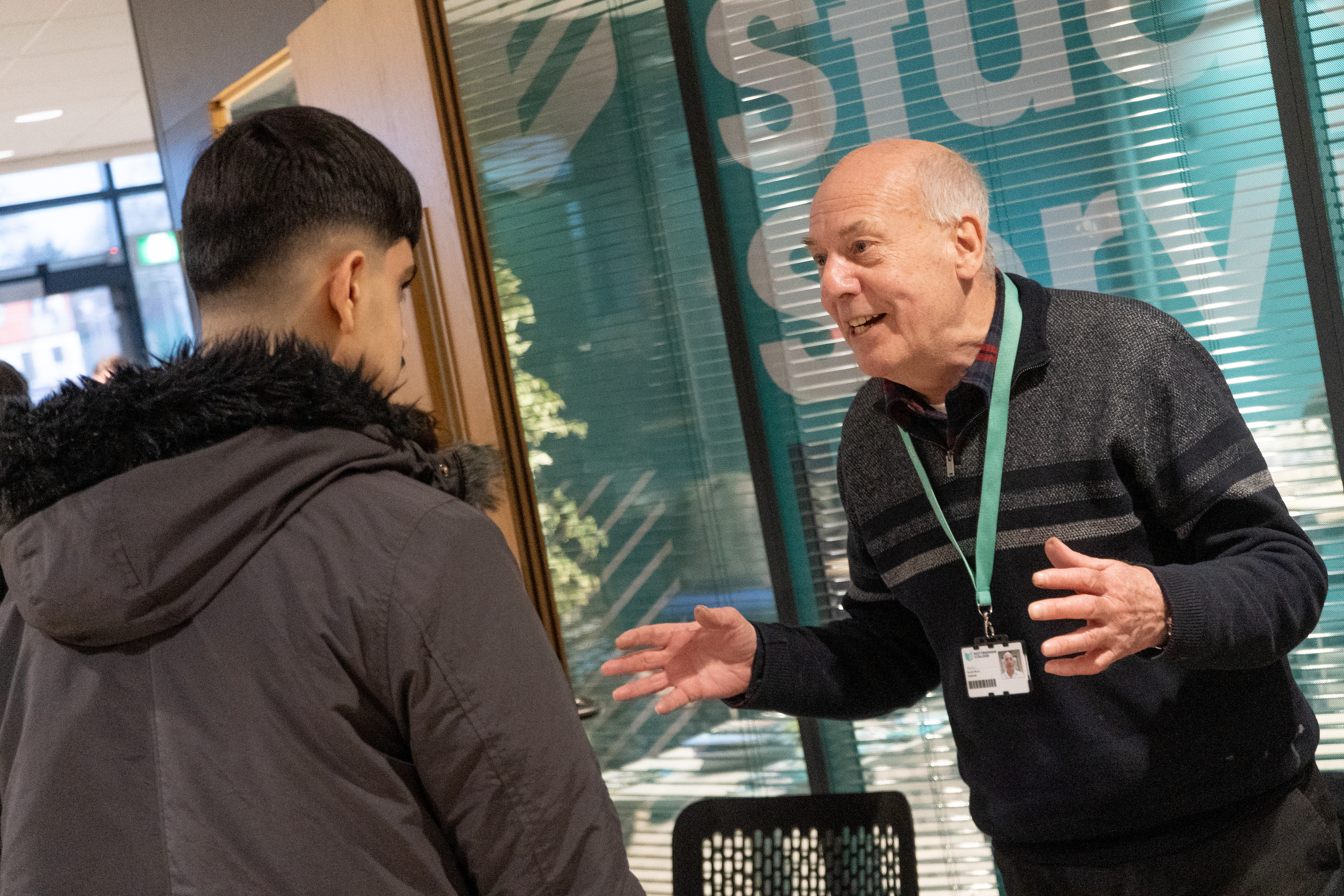 Member of staff speaking to a guest