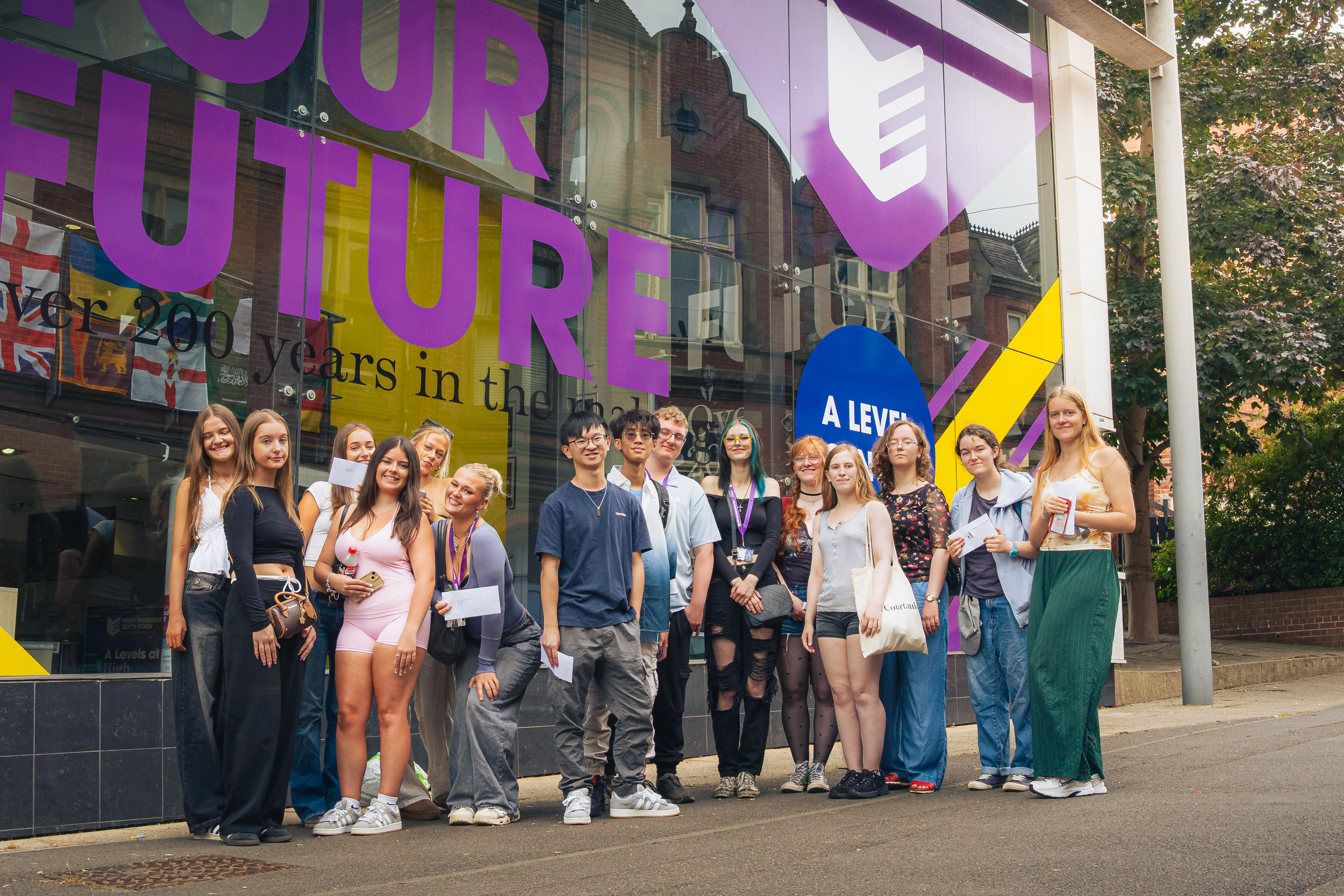 Group shout of students smiling at the front of High Pavement Sixth Form