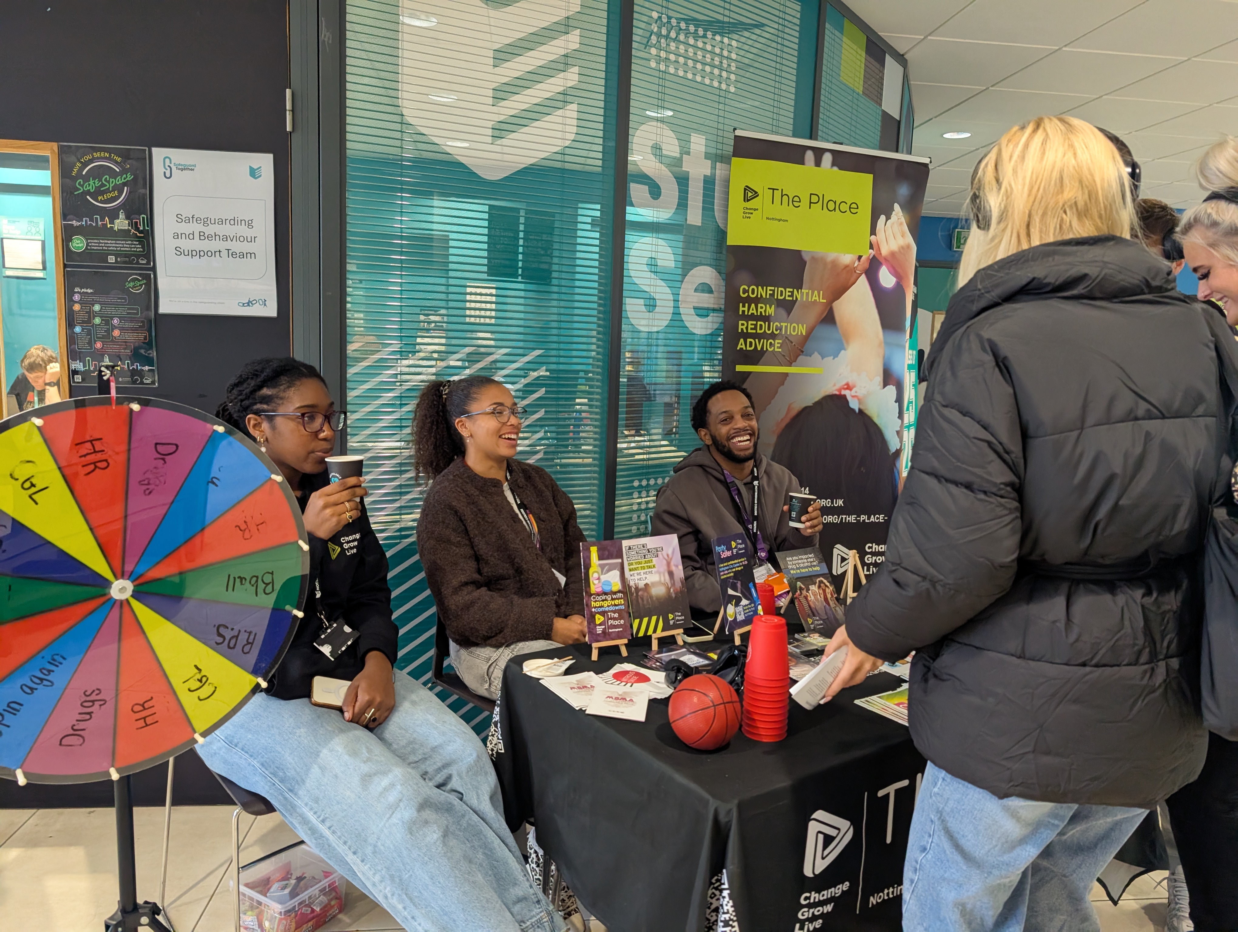 Students Talking to people sat in a stall