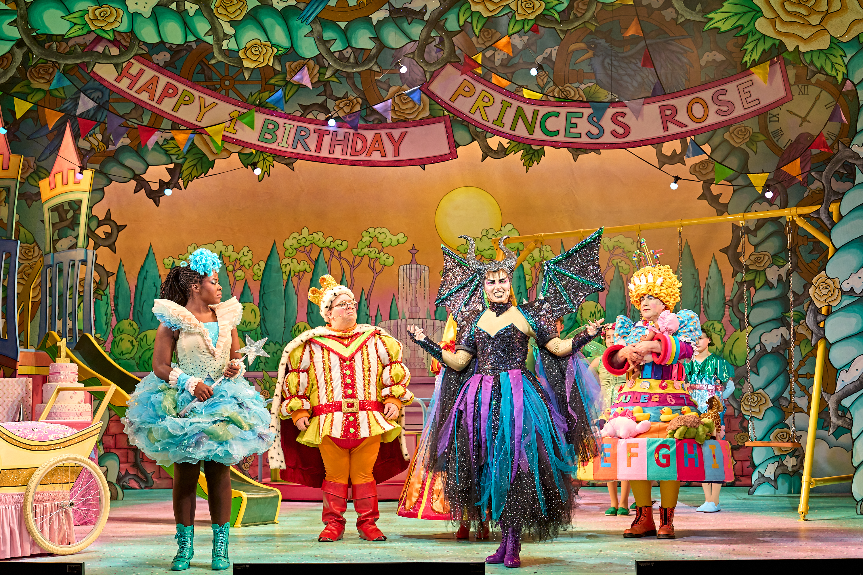 Lara on stage with other characters performing