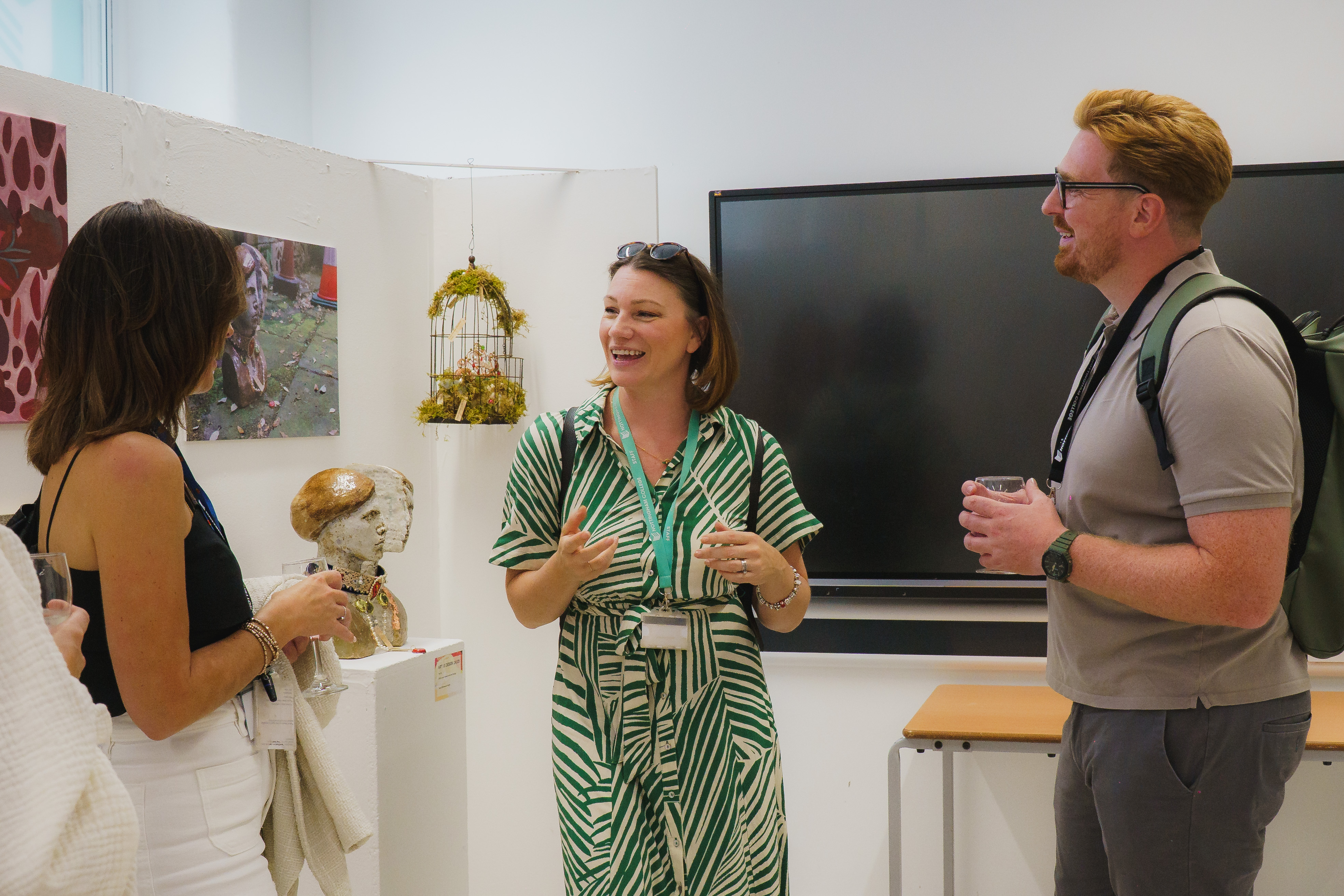 Guests talking in Stoney Street art gallery