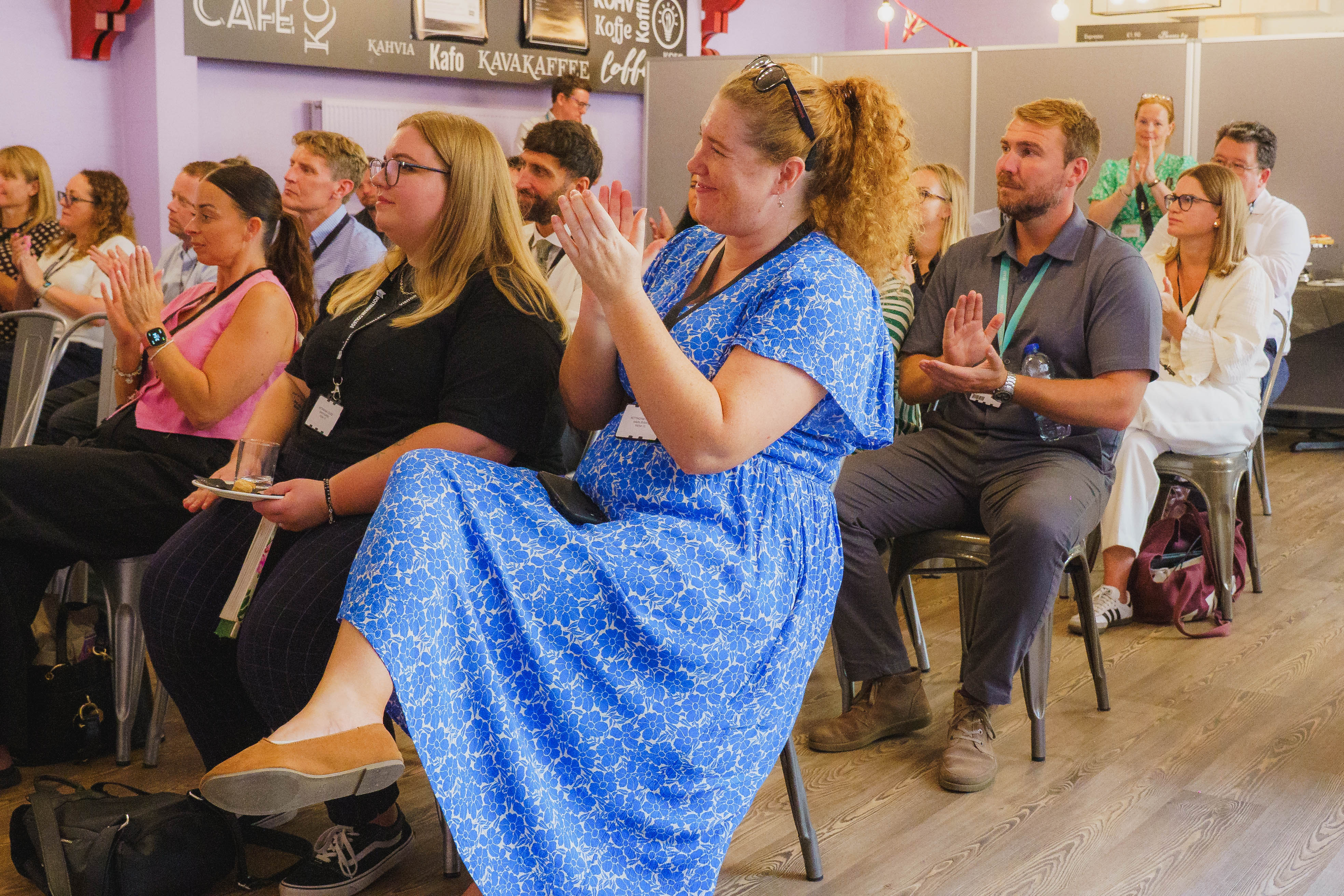 Guests sat engaging with talk at the Partnership Celebration Day
