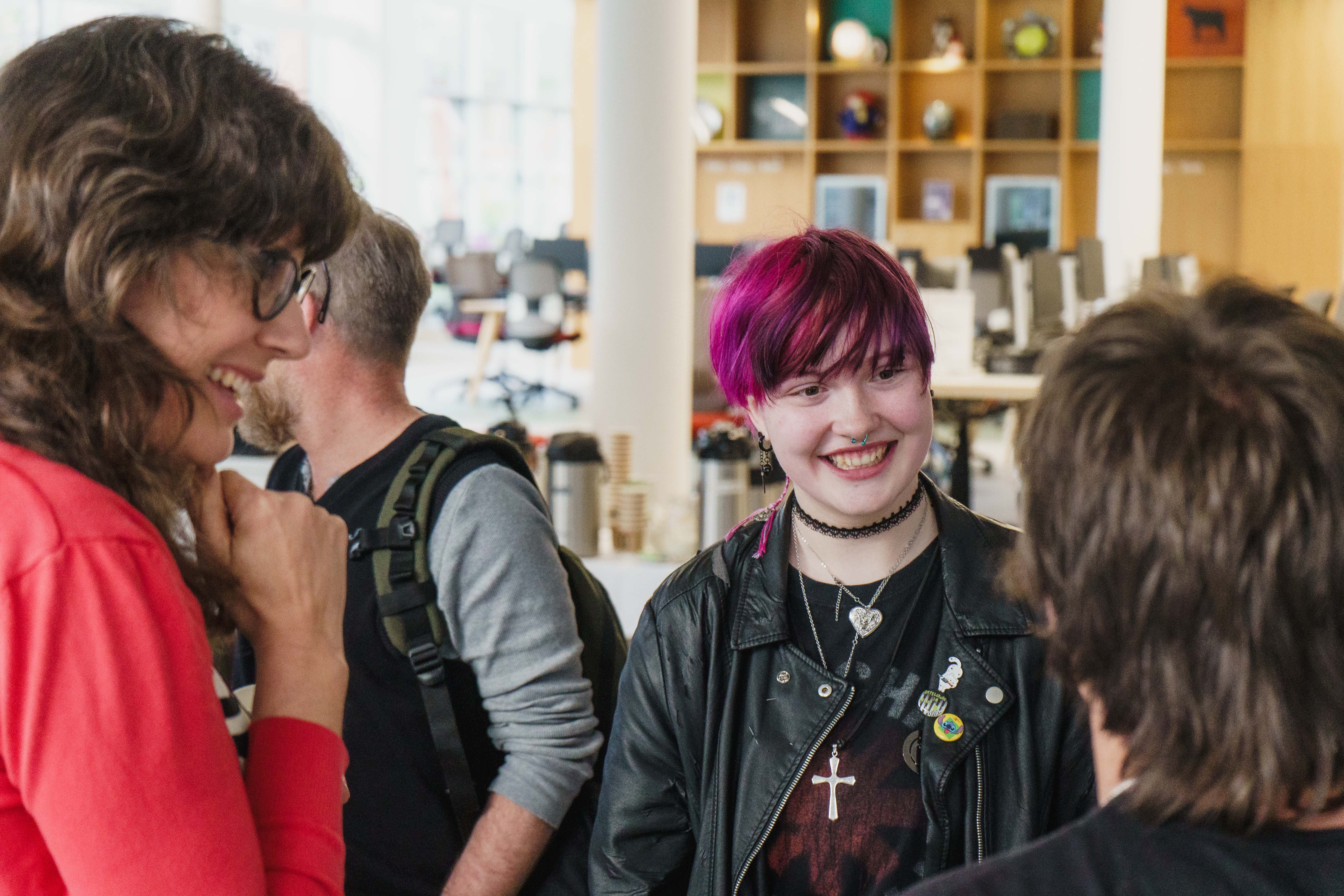 Students and staff talking and smiling