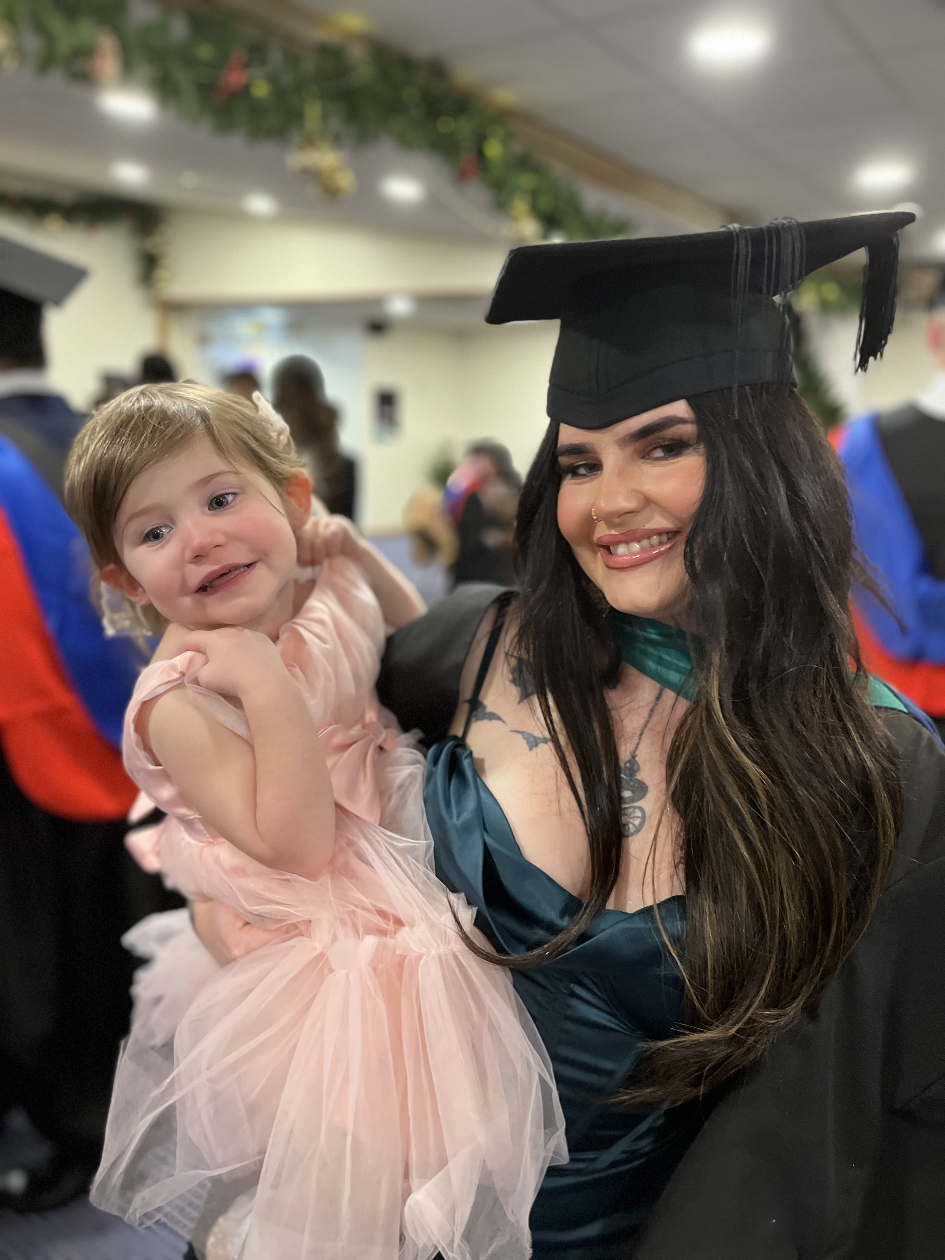 Graduate of the Year Outstanding Achievement winner with her daughter