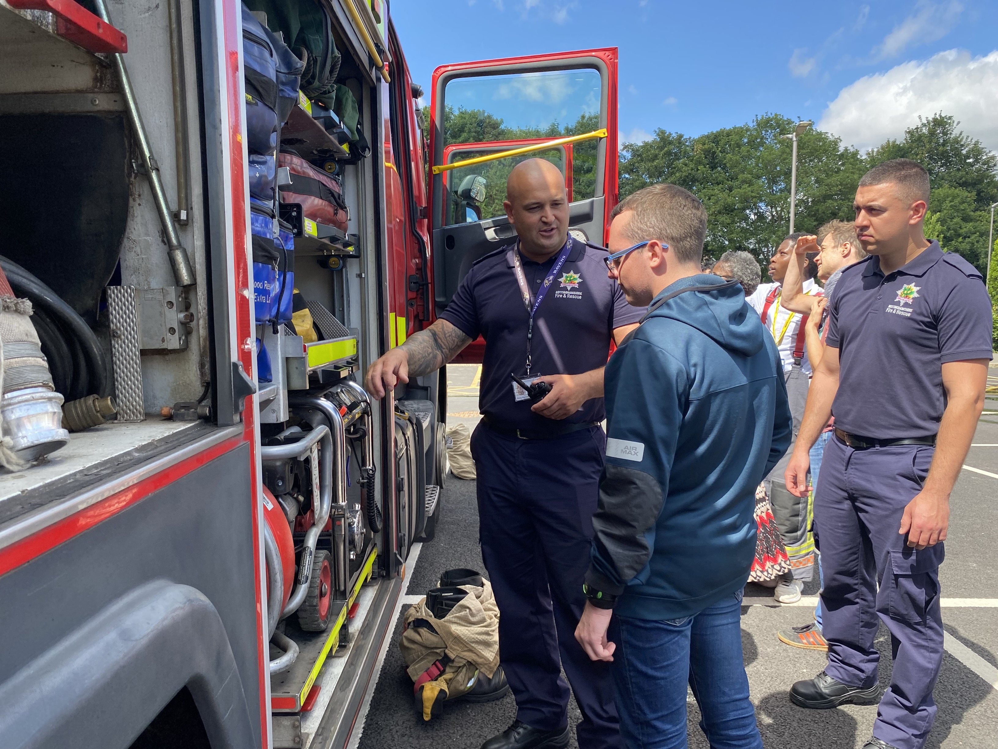 Student being toured round a fire engine