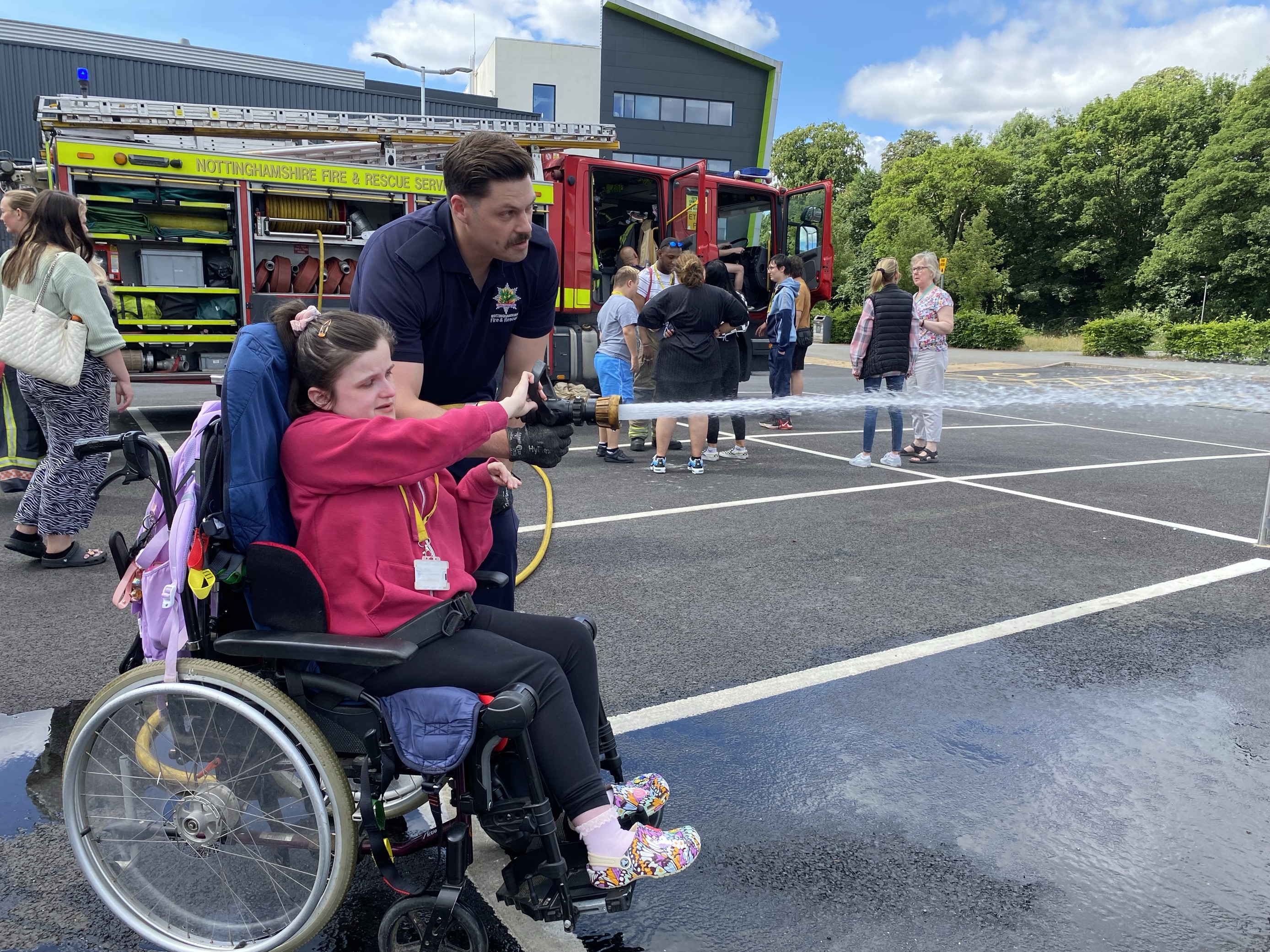 Students using the fire hose