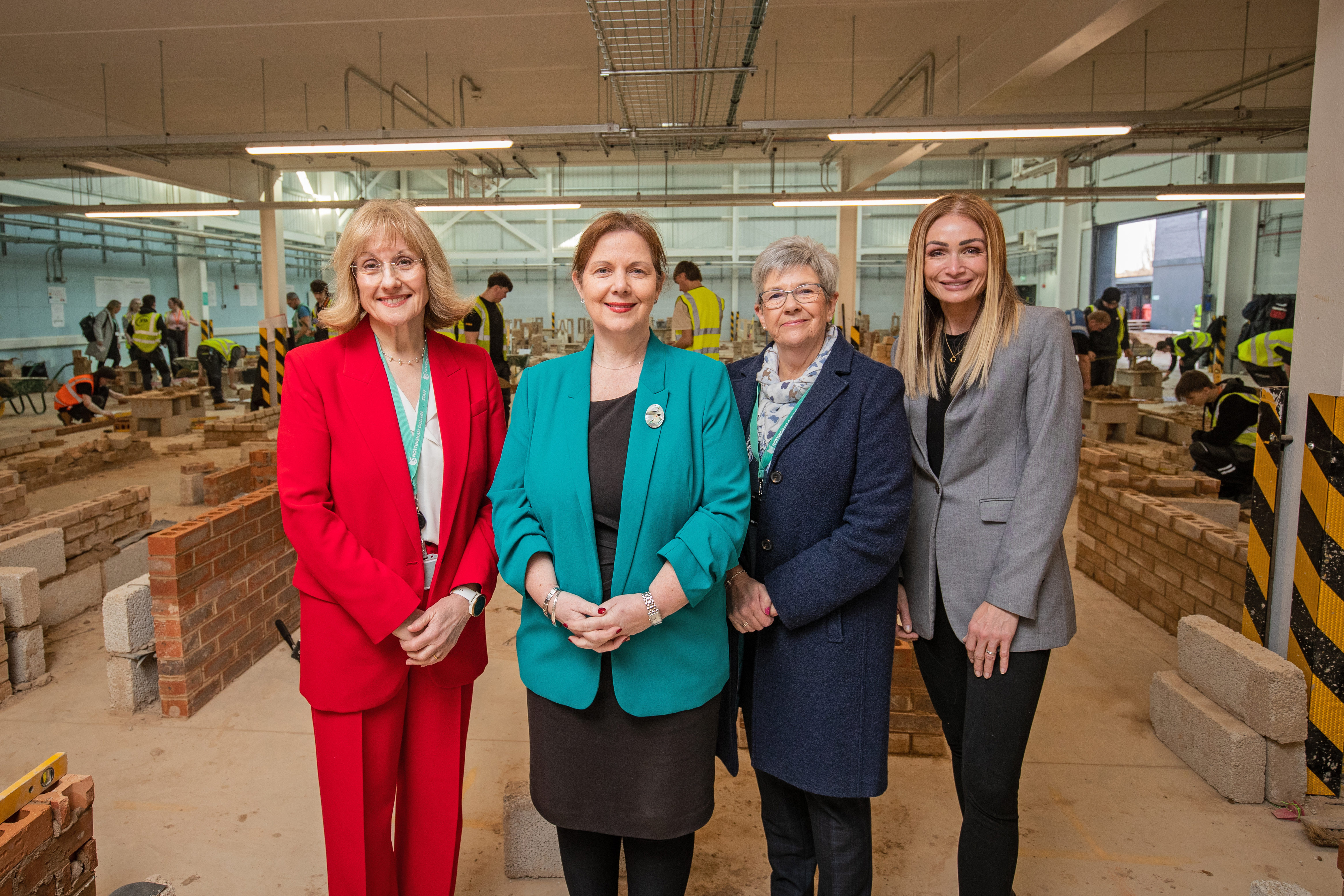 4 women smiling in the construction skills centre
