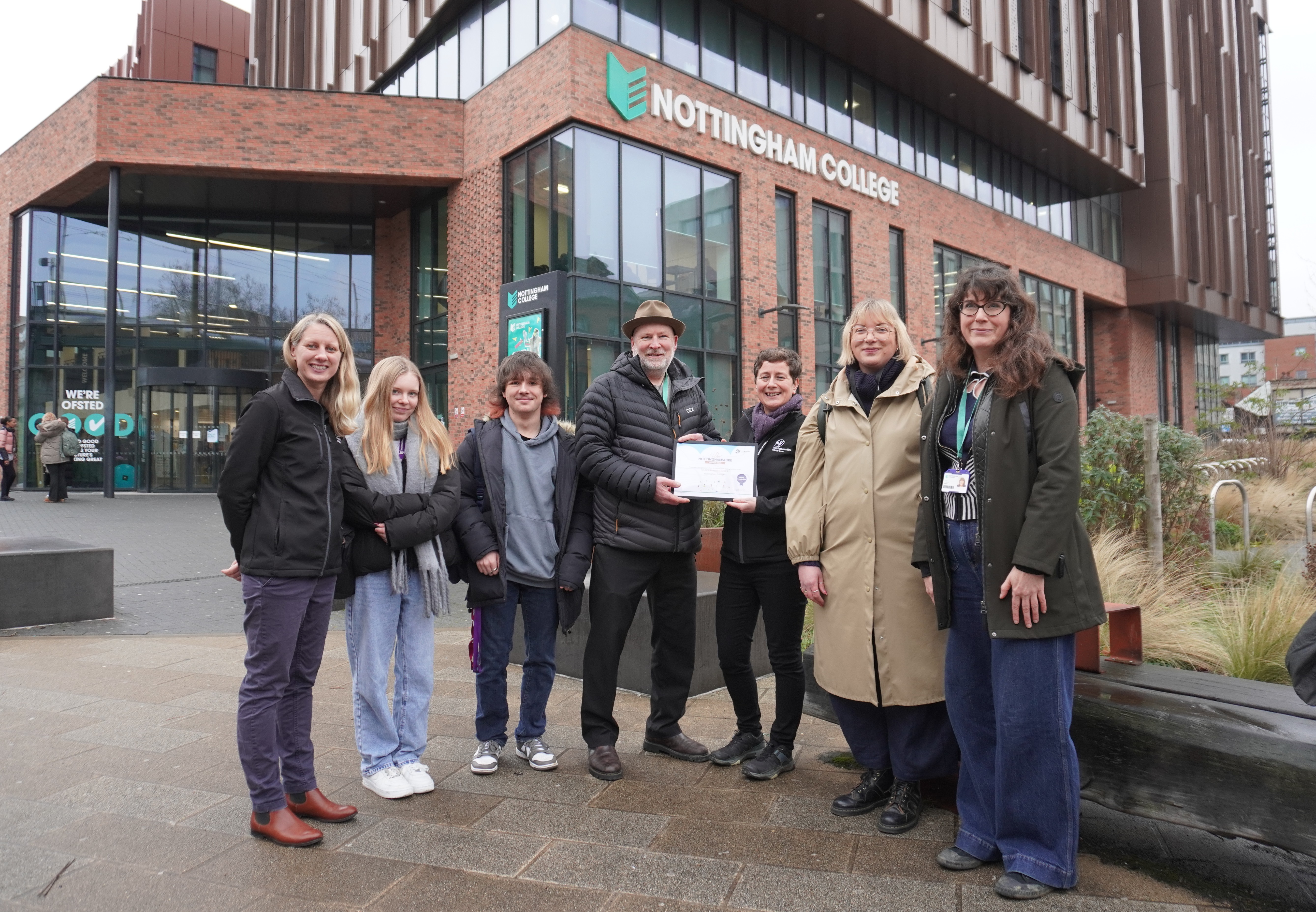 Staff and students being given the wilder award outside of out City Hub campus