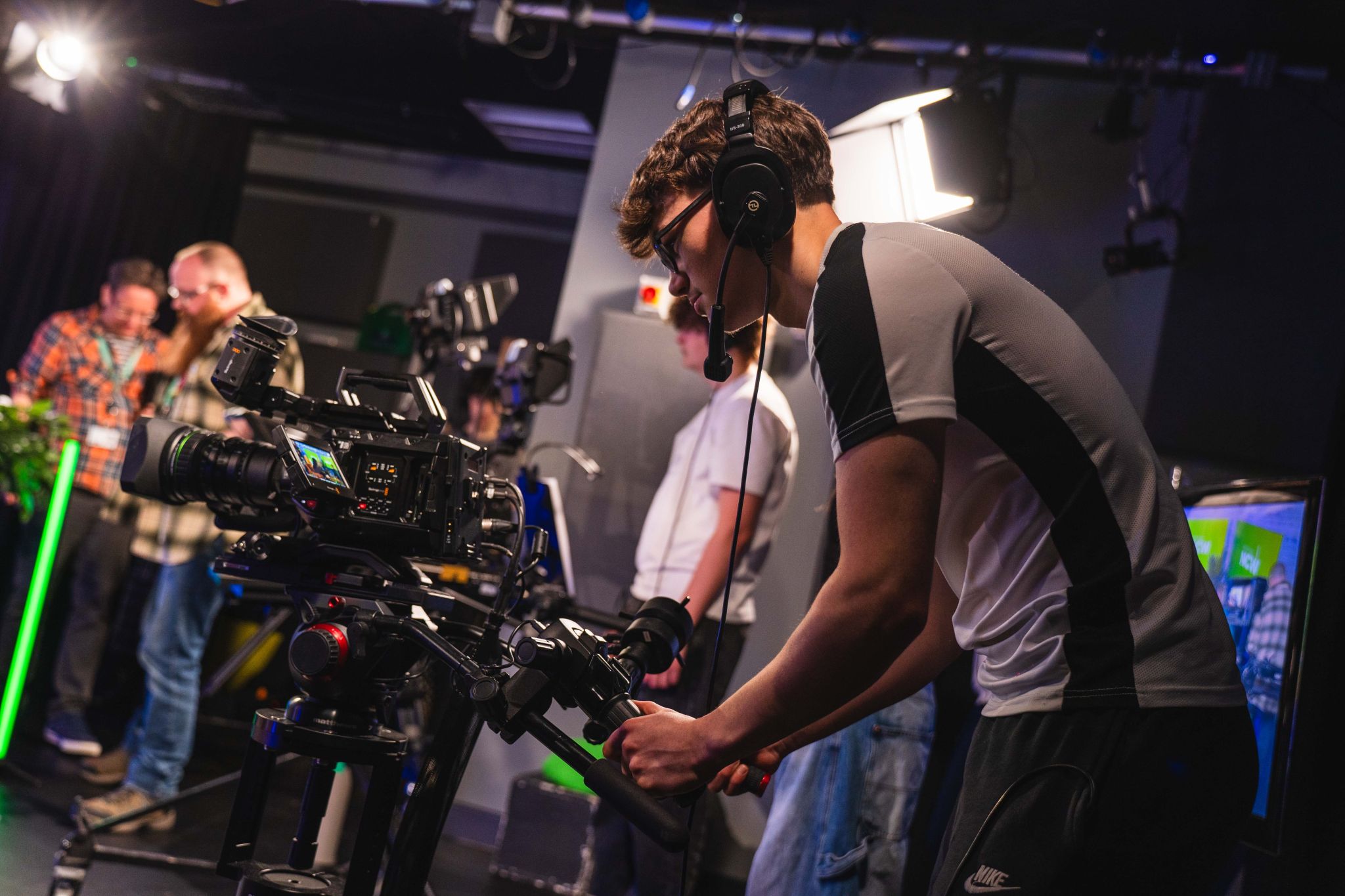 Students filming inside the studio at the City Hub