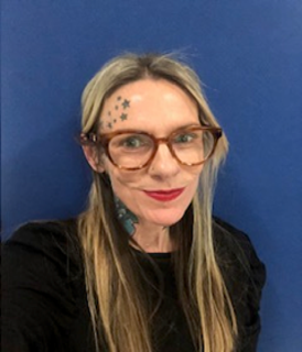 Member of staff smiling