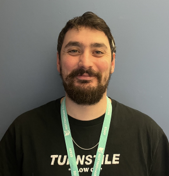 Member of staff smiling