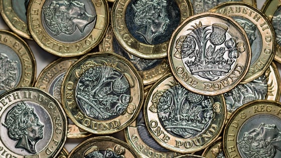A pile of British pound coins