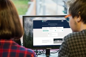 Two students looking at an image.