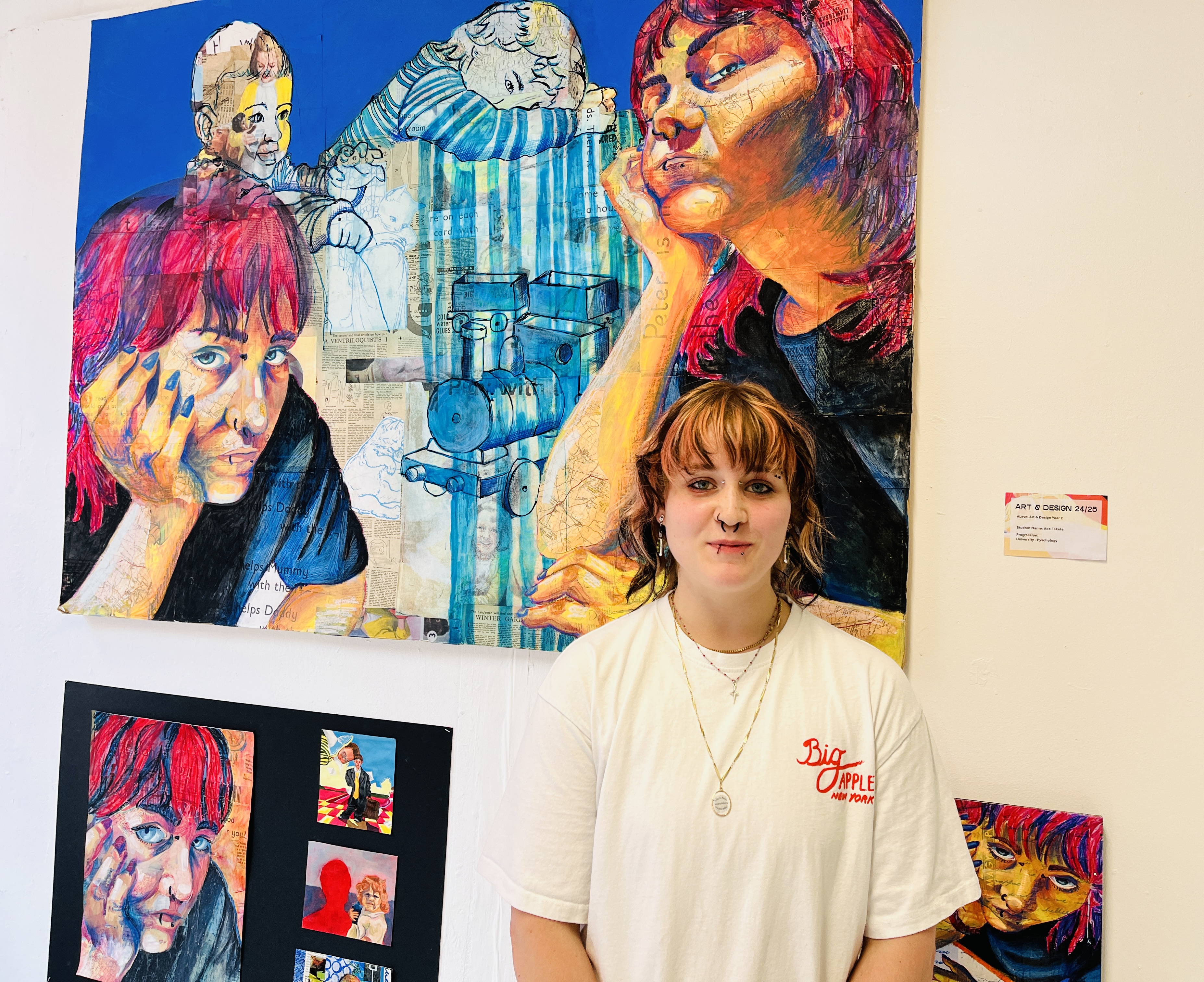 A student stood with their art exhibition