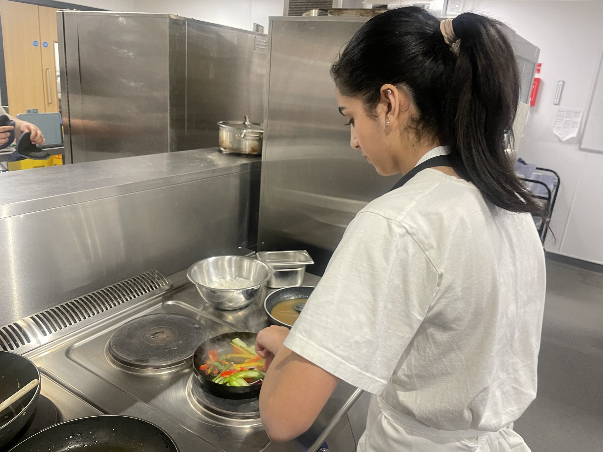 A student working in a kitchen