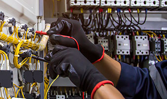 A student fixing a wiring board.