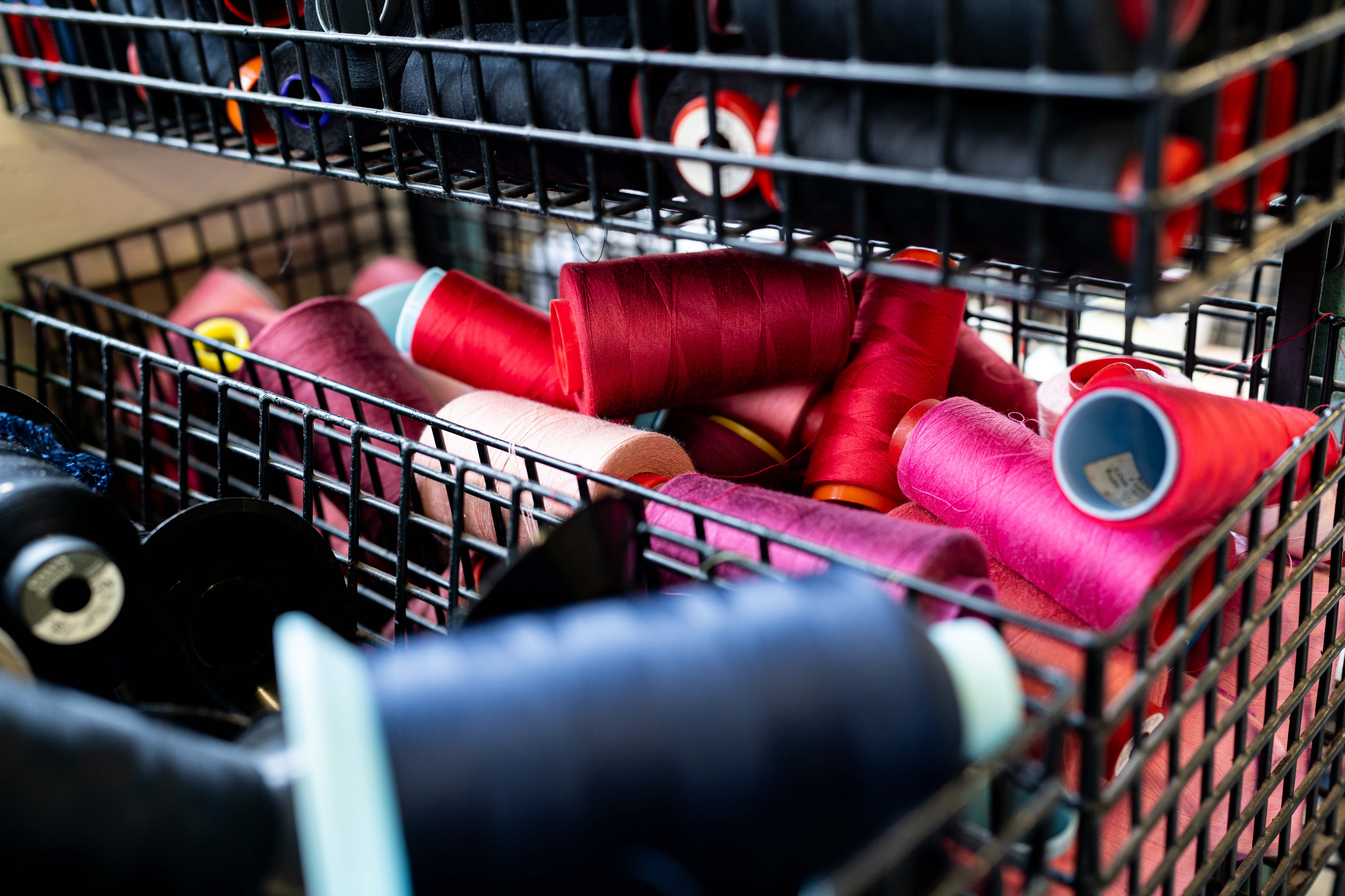 A basket of various colours of threads