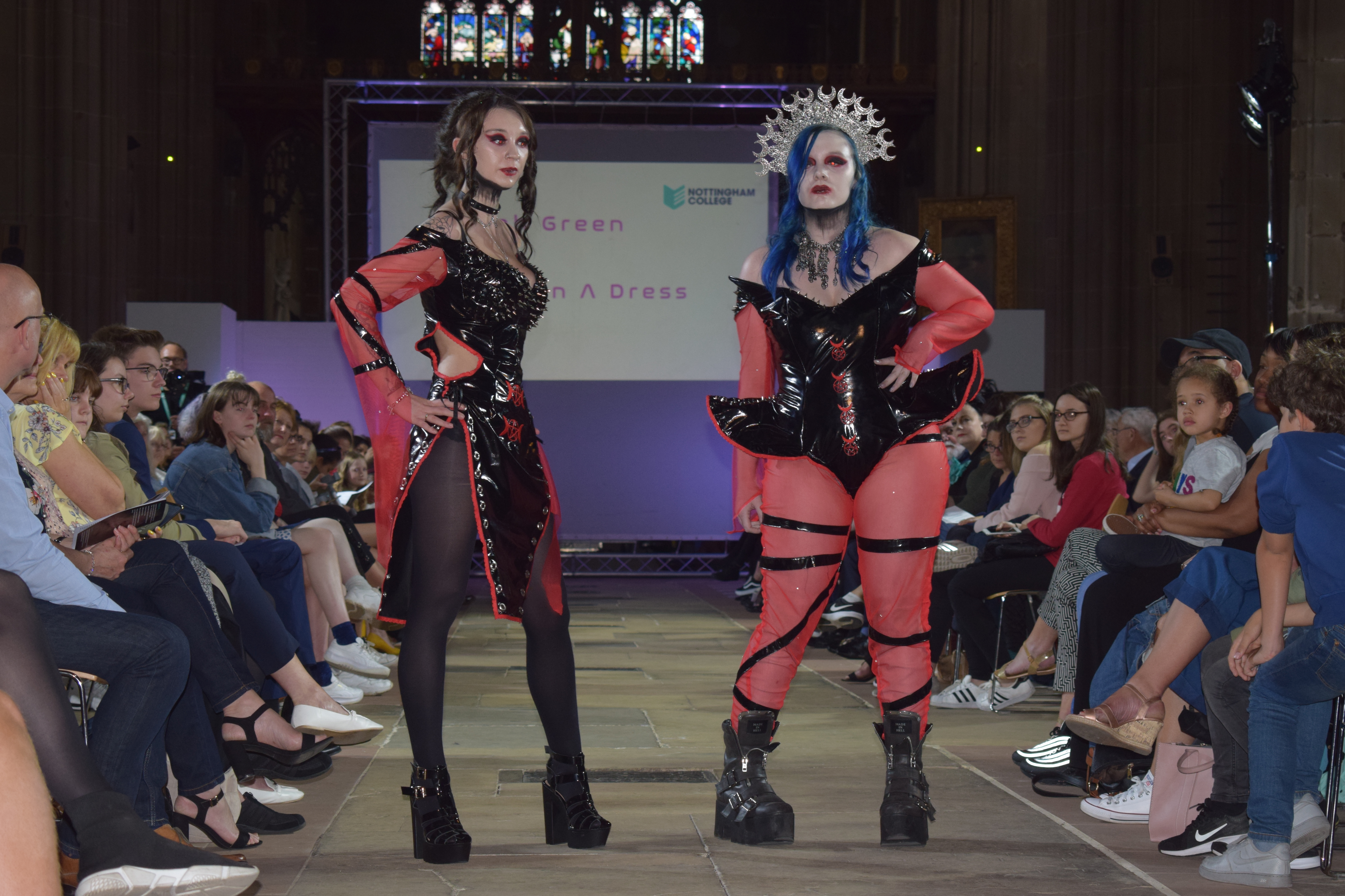 2 students posing at the end of the runway