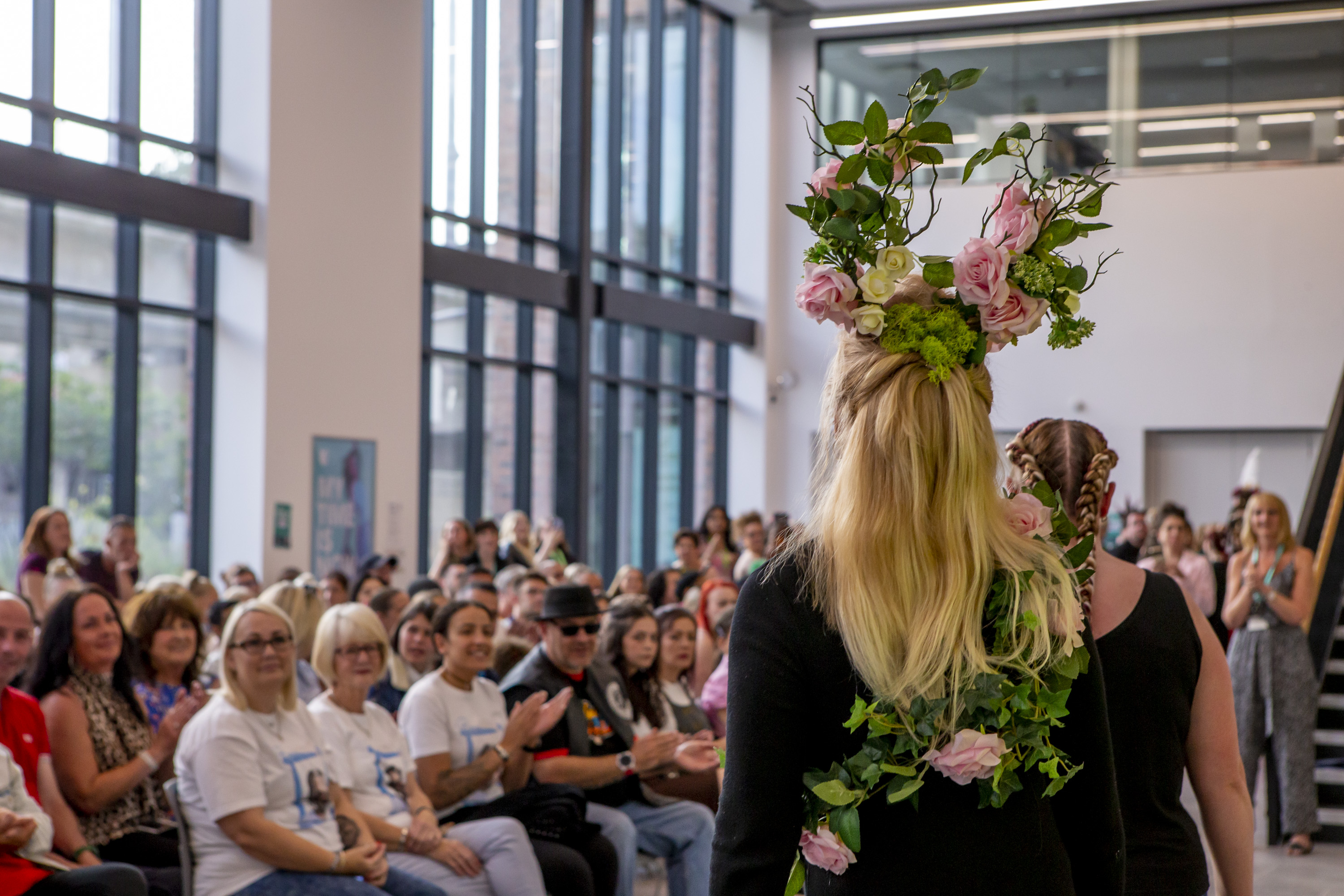Student wearing a floral headpiece with pink roses