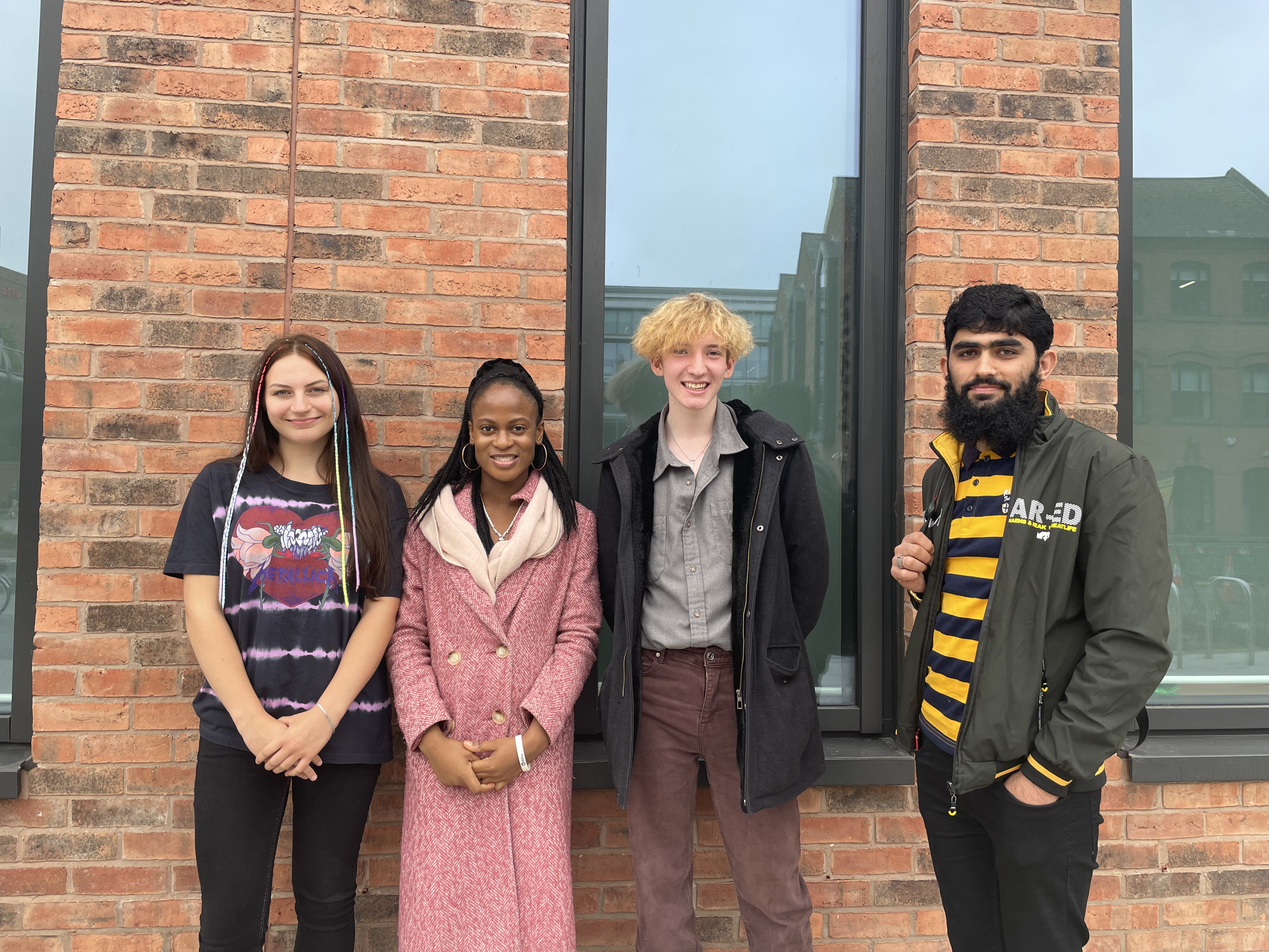 A group of students stood outside of the city hub campus