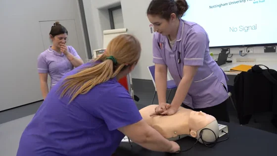 Students practicing CPR on a dummy