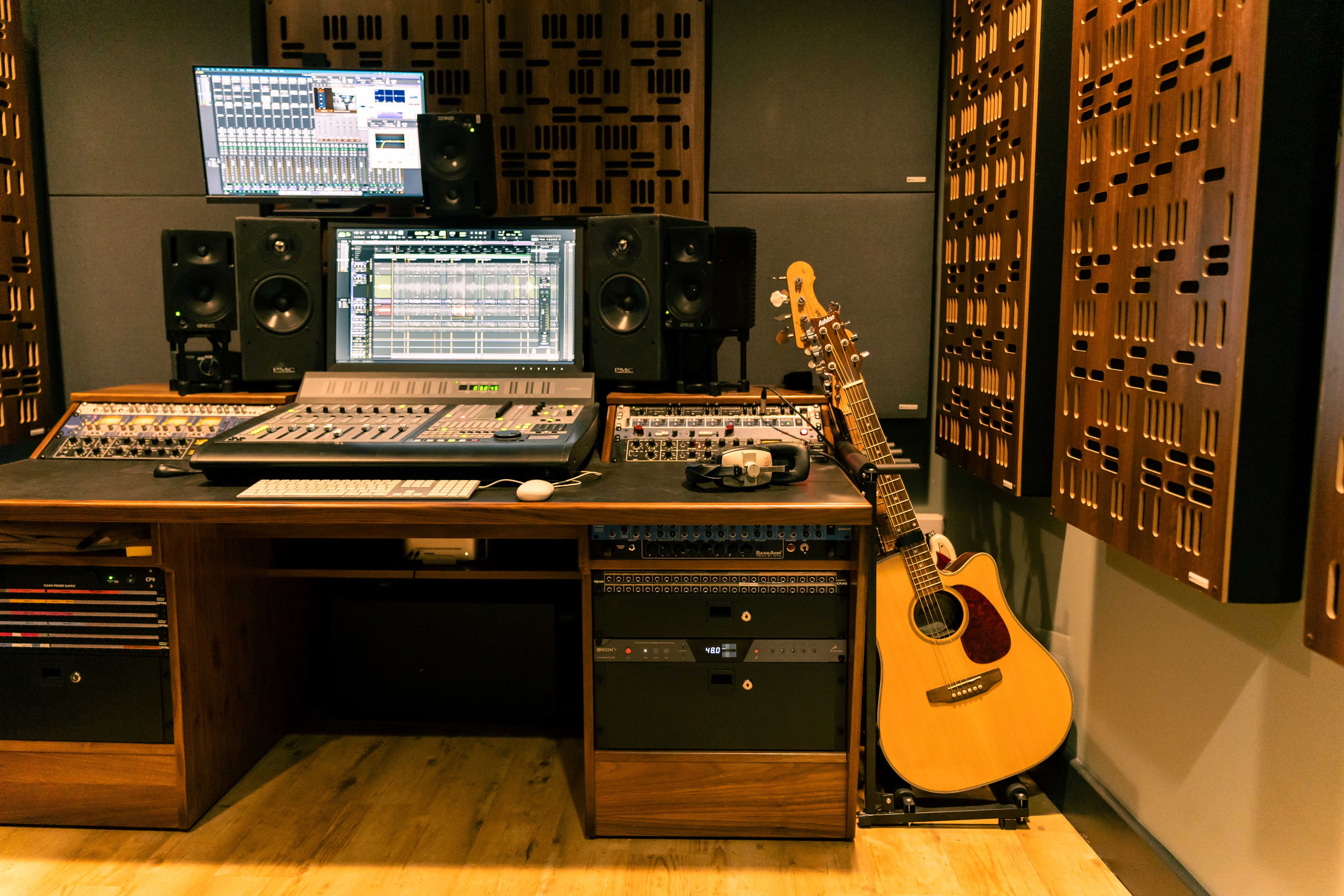 Music equipment and decks with a stack of guitars