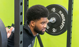 A student lifting weights.