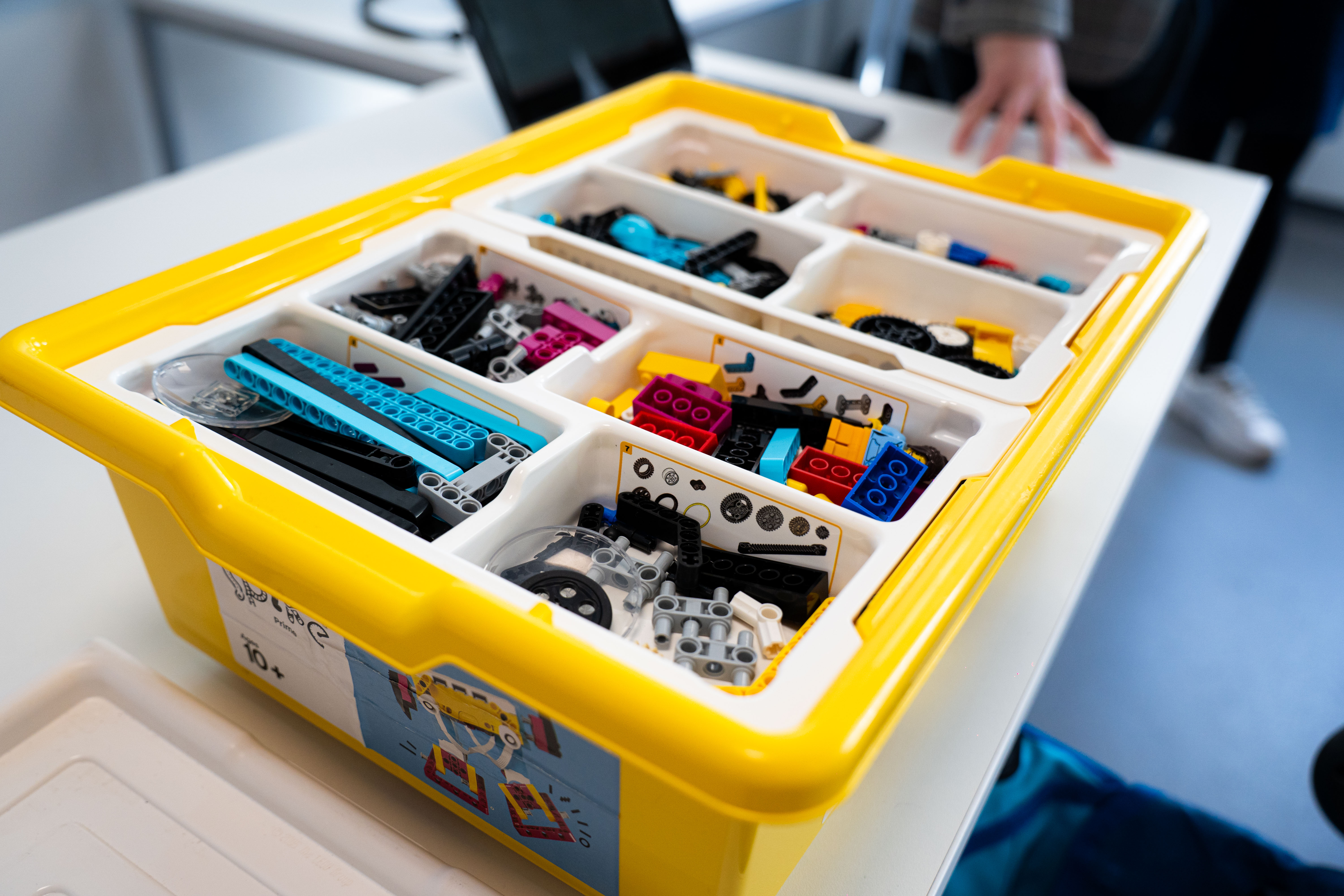 Box of lego parts in classroom