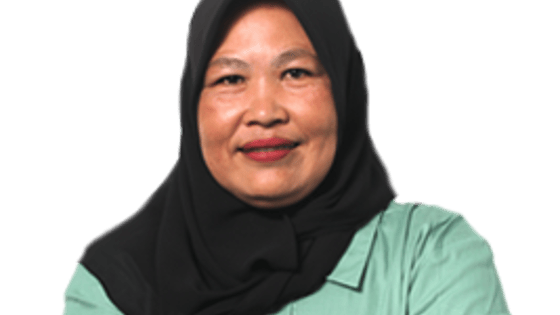 A smiling lady wearing a headscarf with her arms crossed.