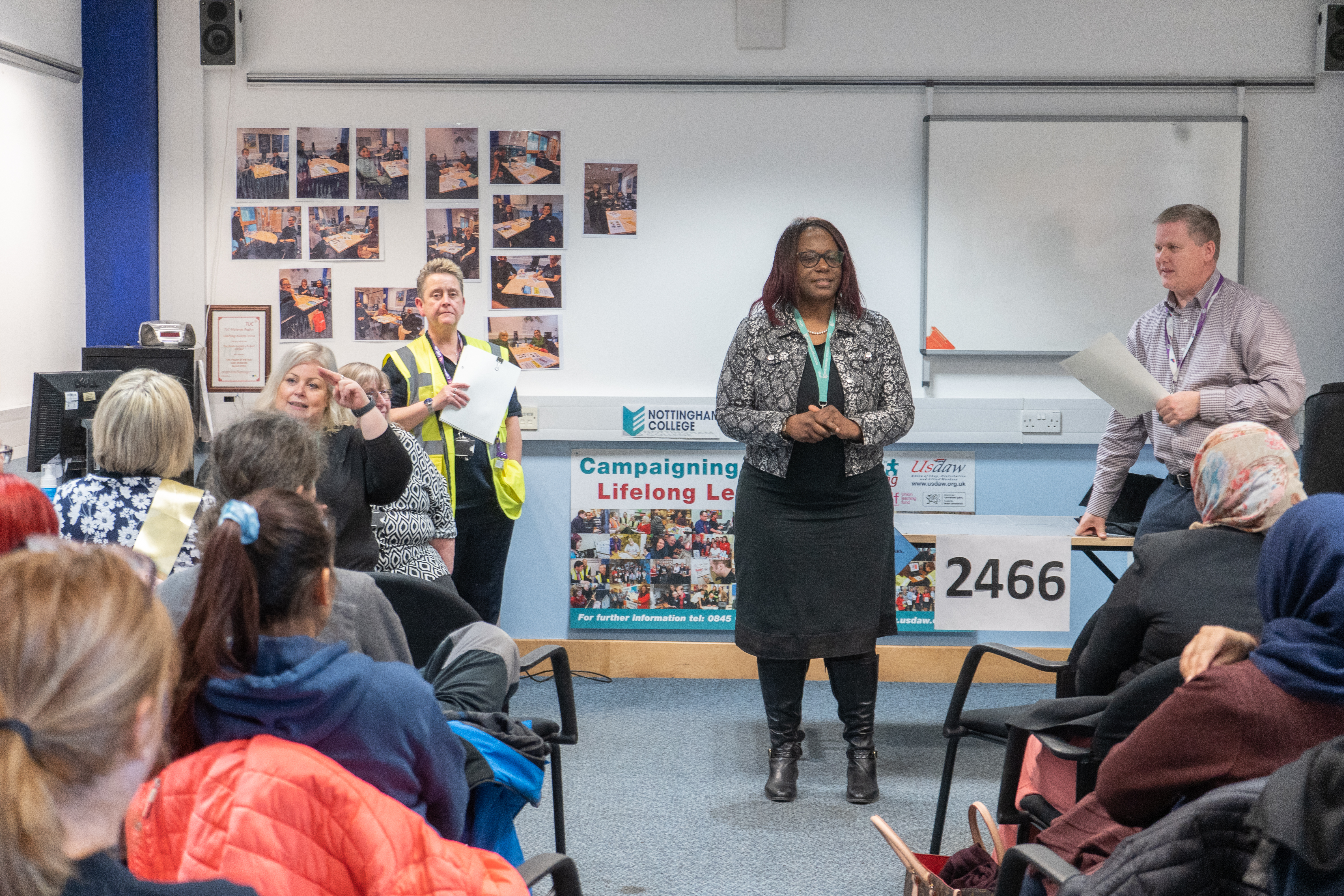 Adult learners sat in a classroom listening to the tutor