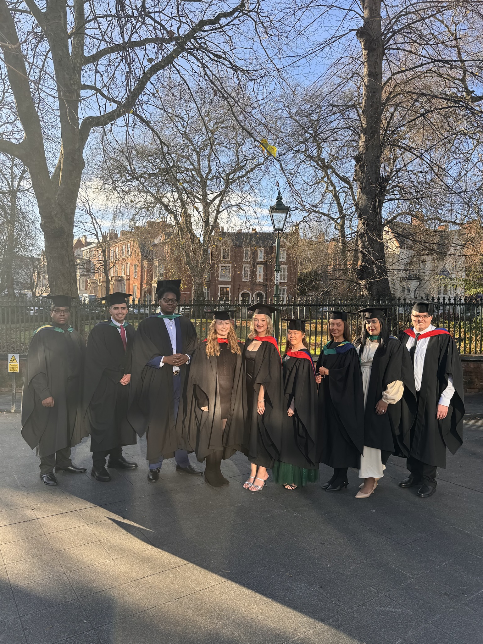 Graduates throwing their caps in the air.