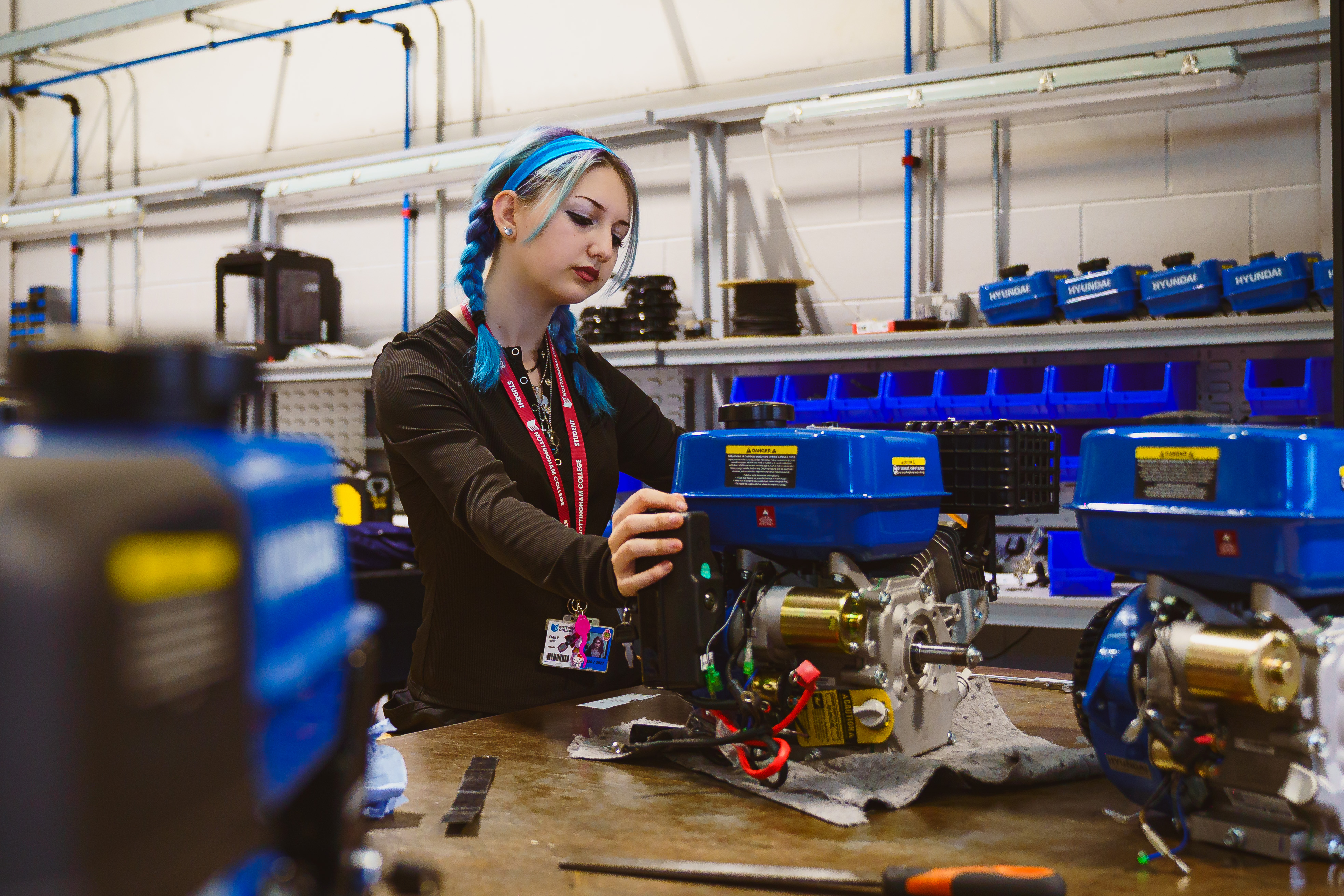 T level student working with some engineering equipment in a workshop