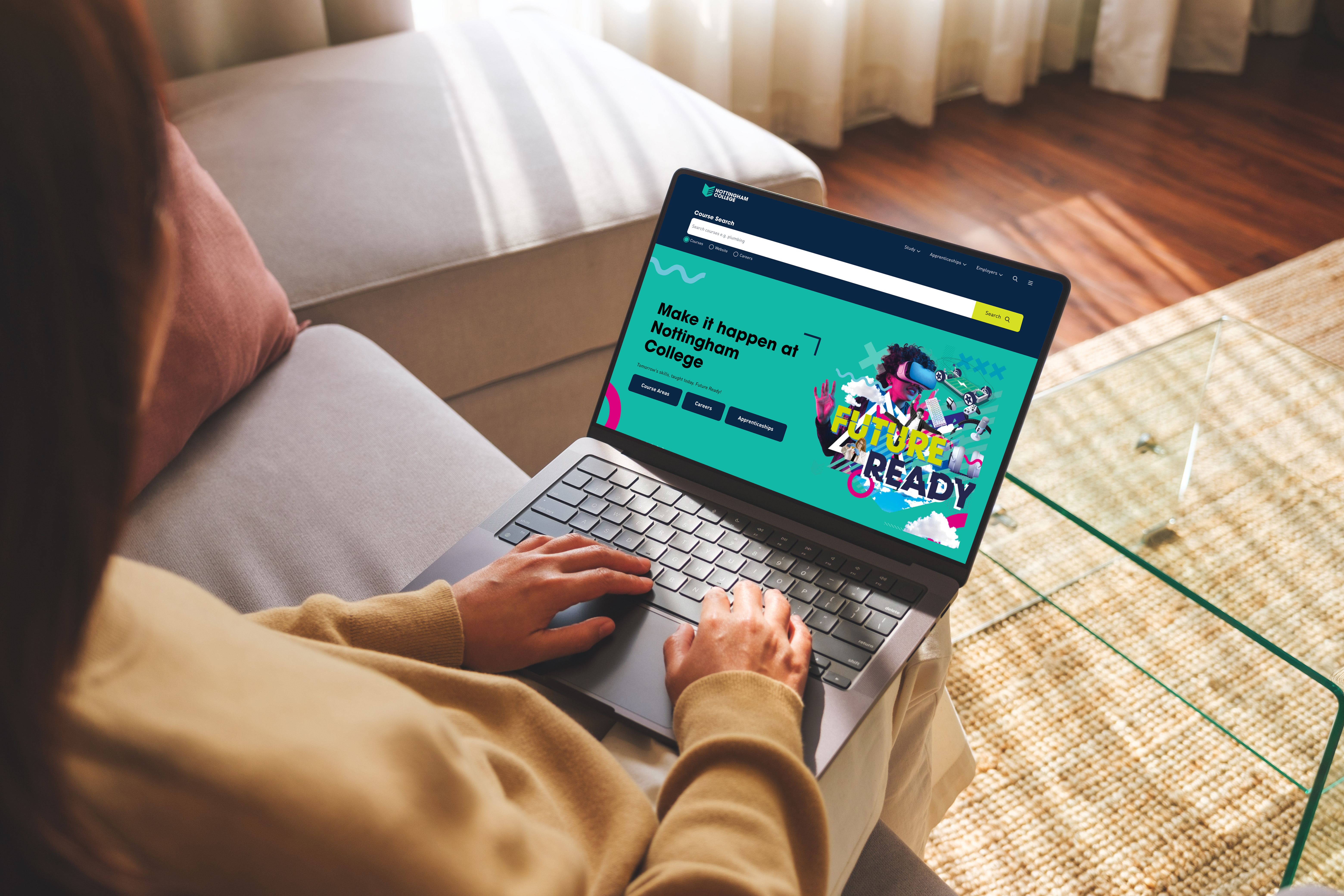 Person with a laptop on their lap showing the Nottingham College website on screen