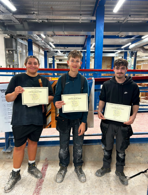 Students receiving their certificates for the competition