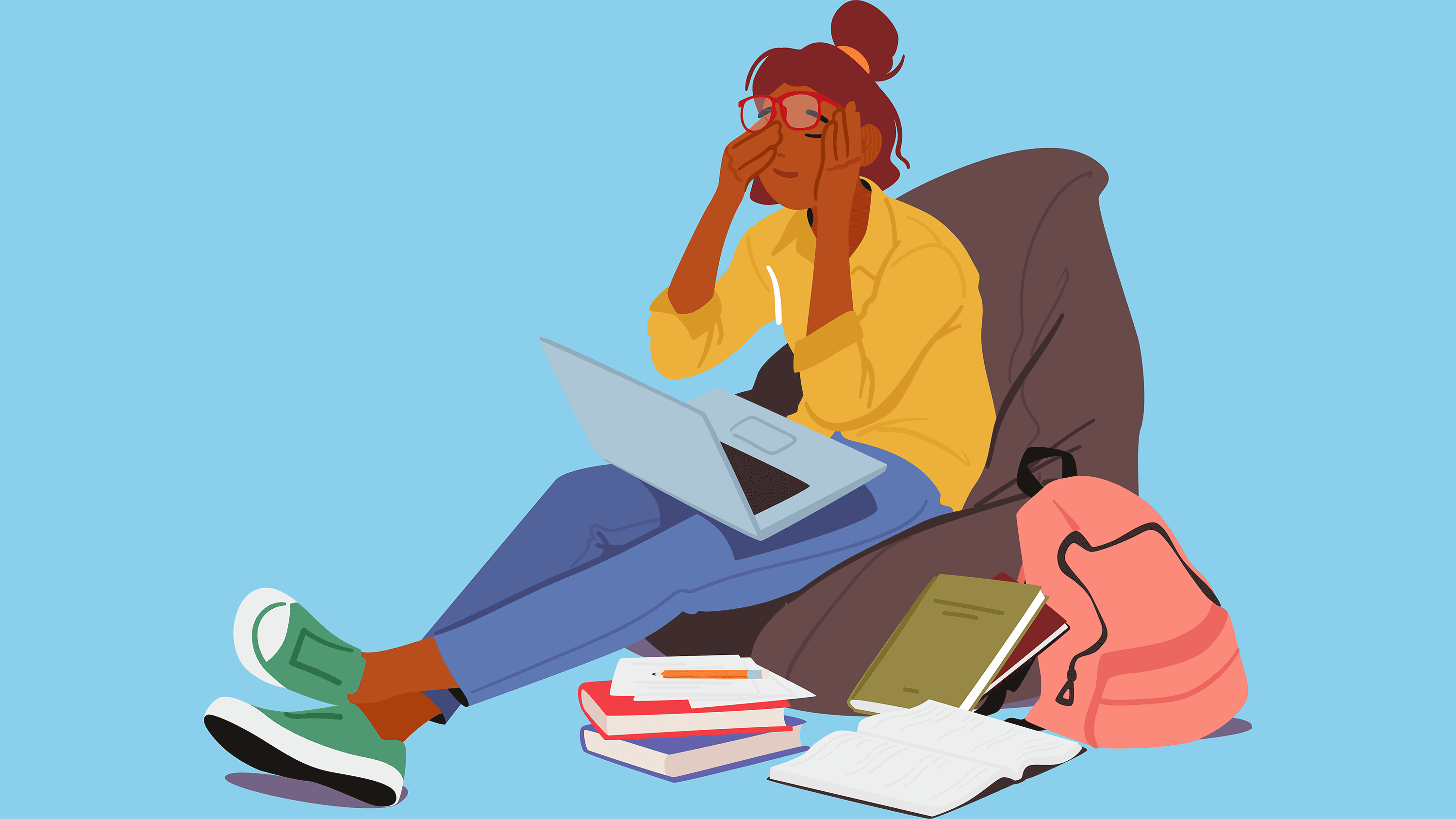 Stressed teenager with laptop and books