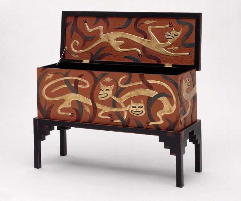 Wooden chest with leopards painted on it