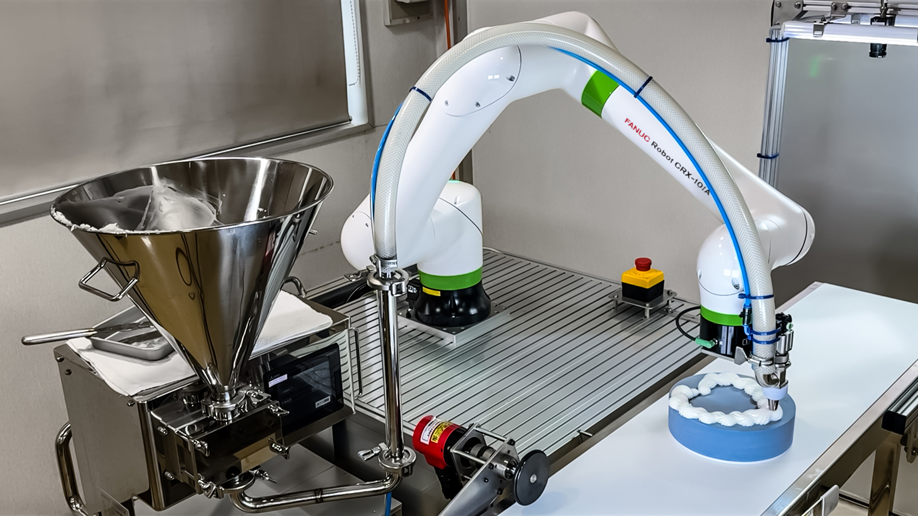 CRX 10i A Dispensing Icing on Moving Cake on a Conveyor