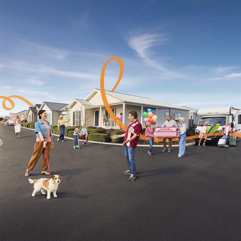 Residents celebrating together on a sunny street at Lifestyle Communities.”