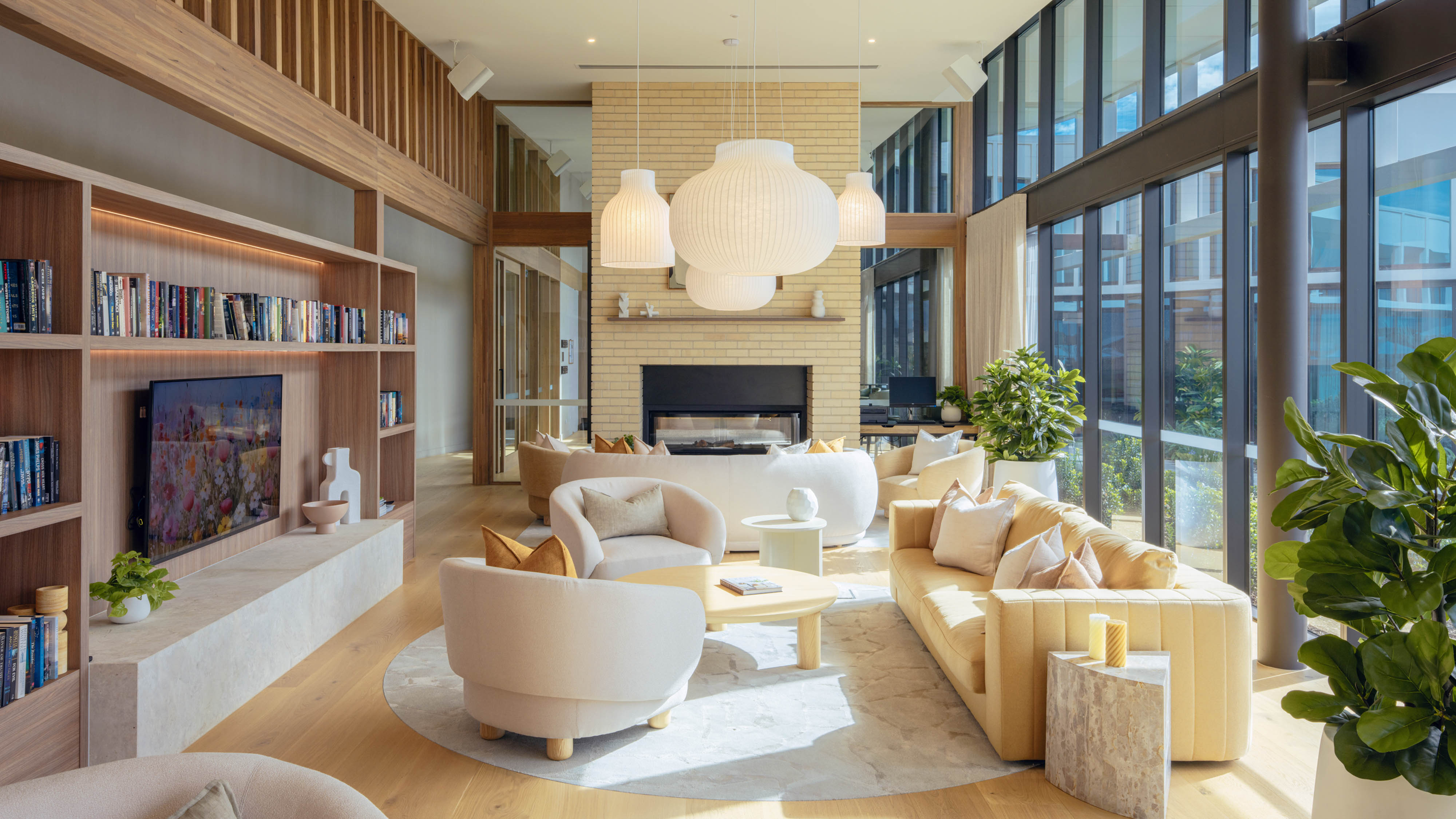 Bright and cozy clubhouse lounge with natural light and modern furnishings at Lifestyle Woodlea.