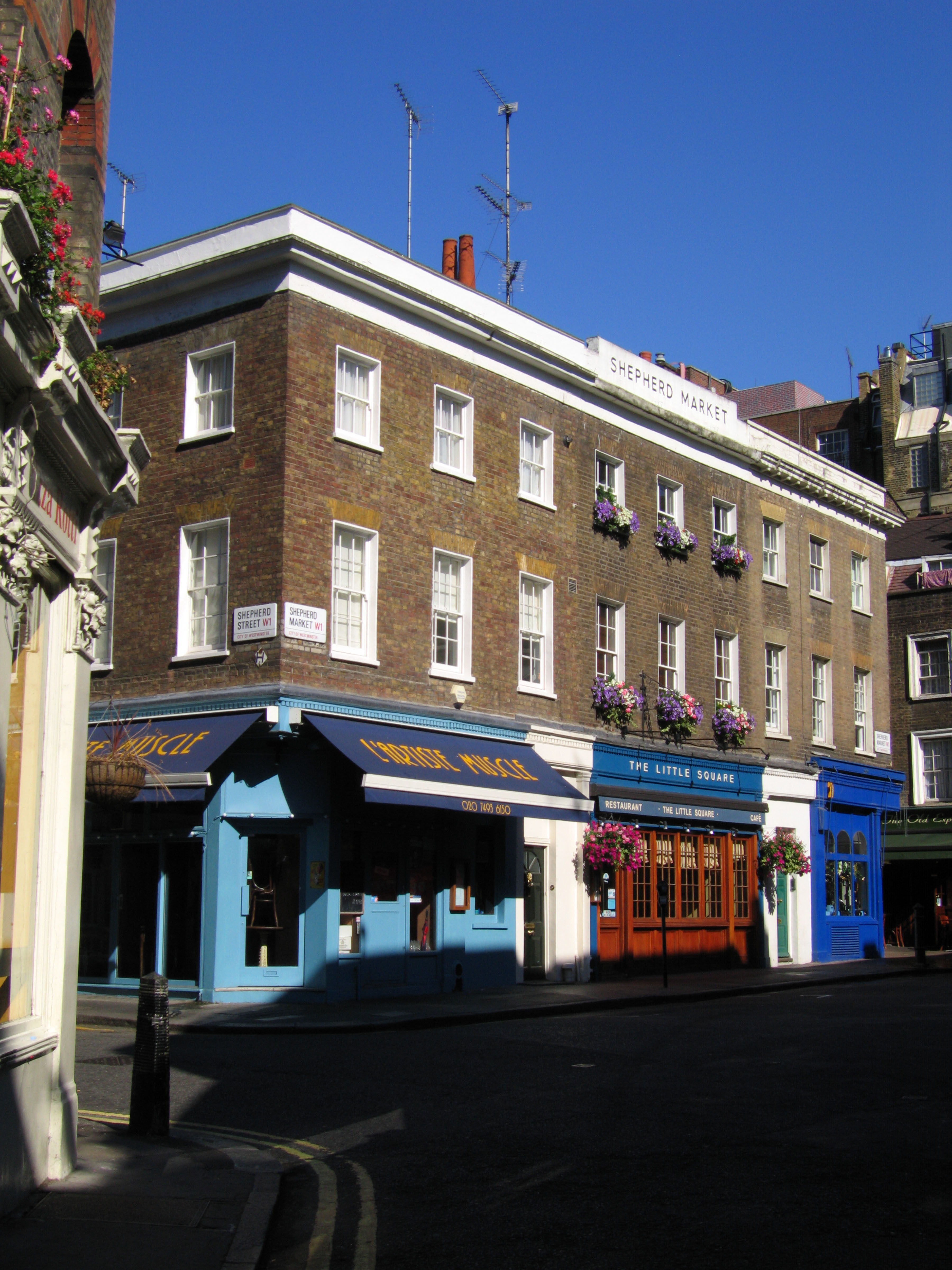 Sunrise in Shepherd Market on blue shops